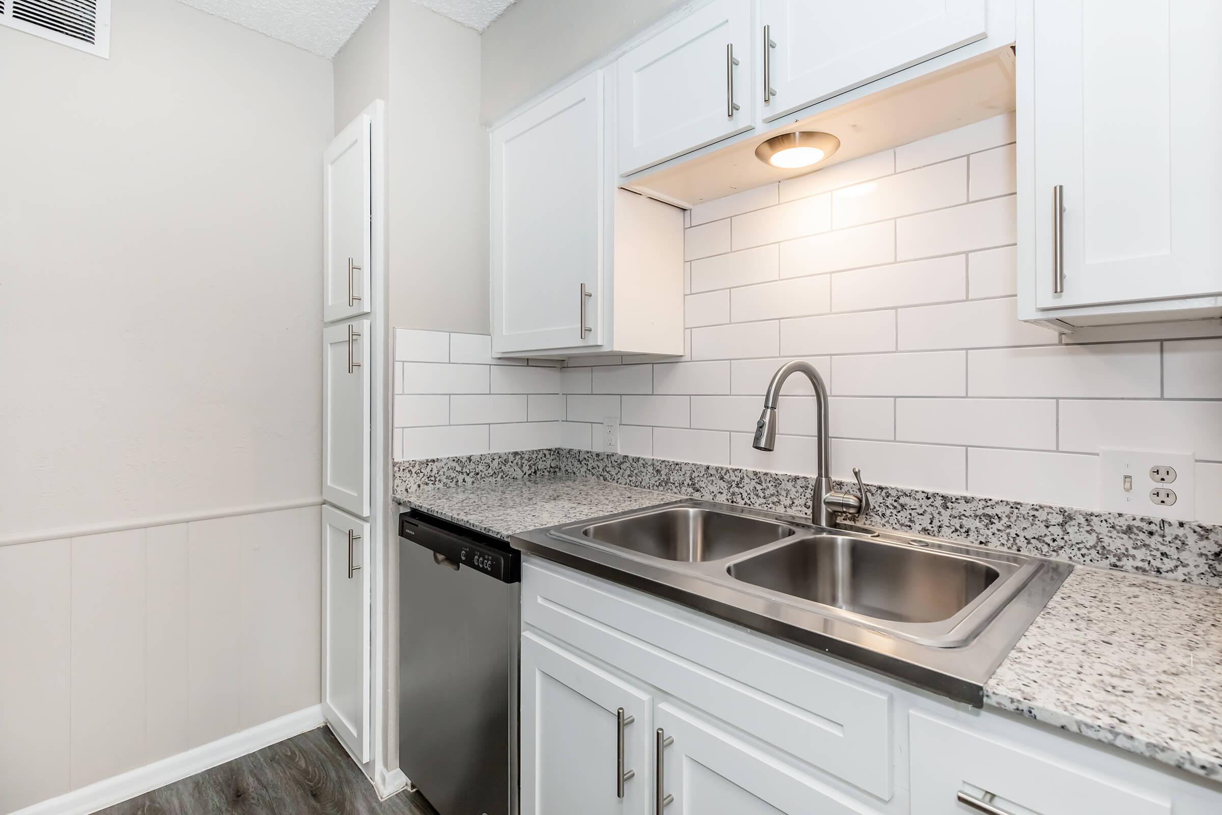 a kitchen with a stove and a sink