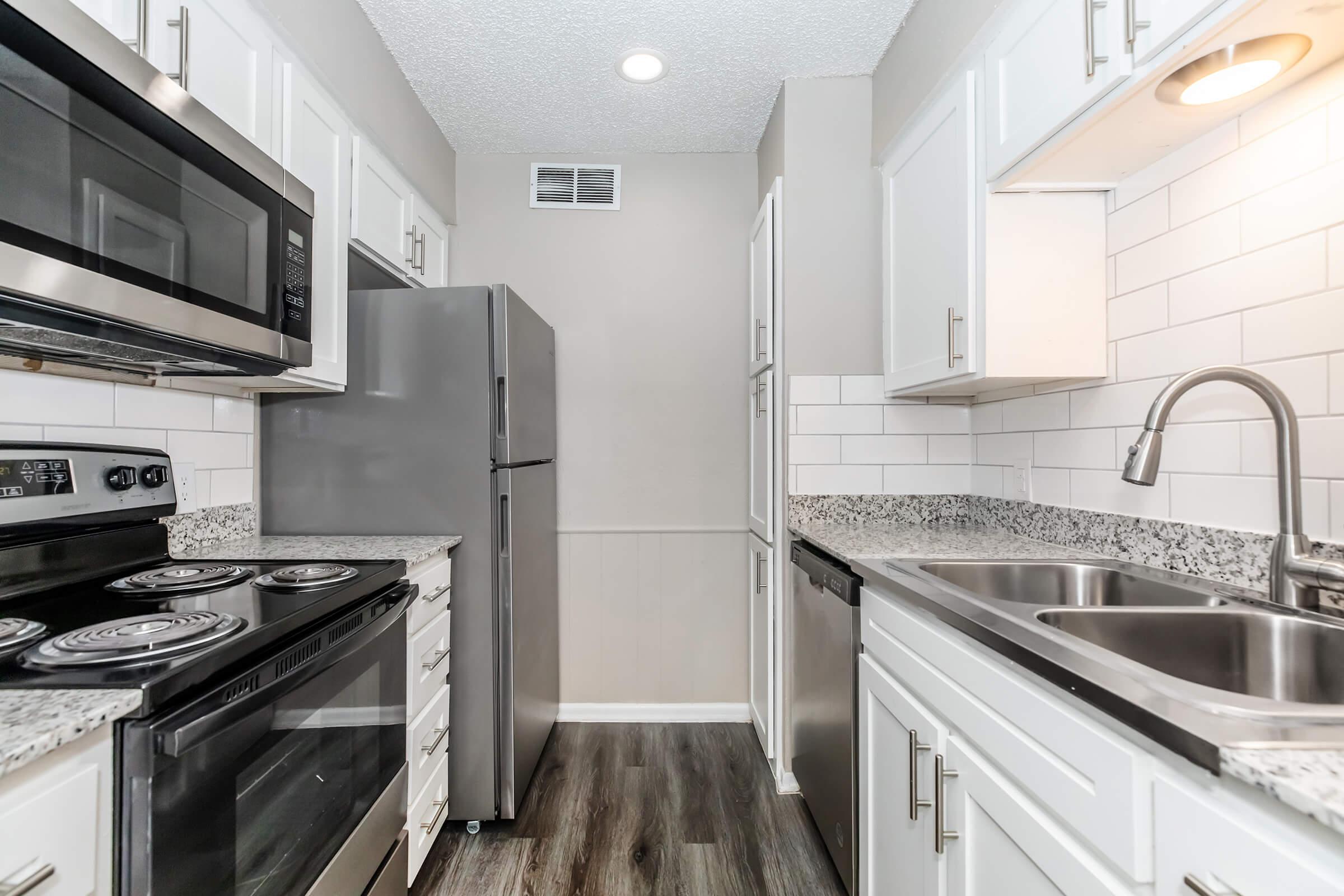 a kitchen with a stove top oven