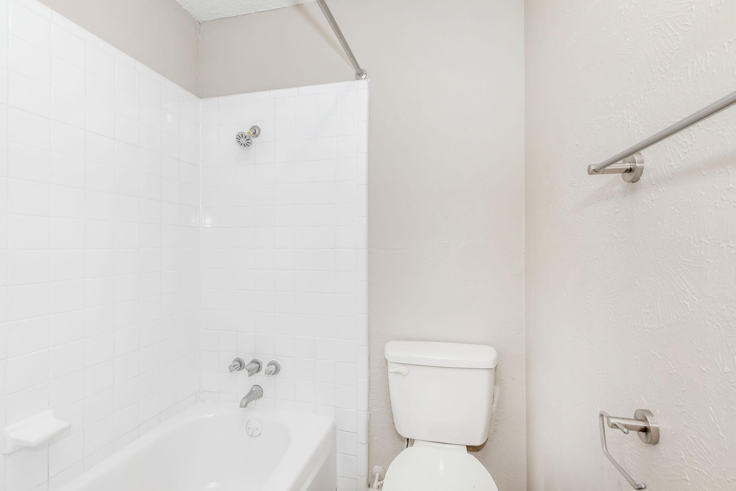 a close up of a sink and a shower