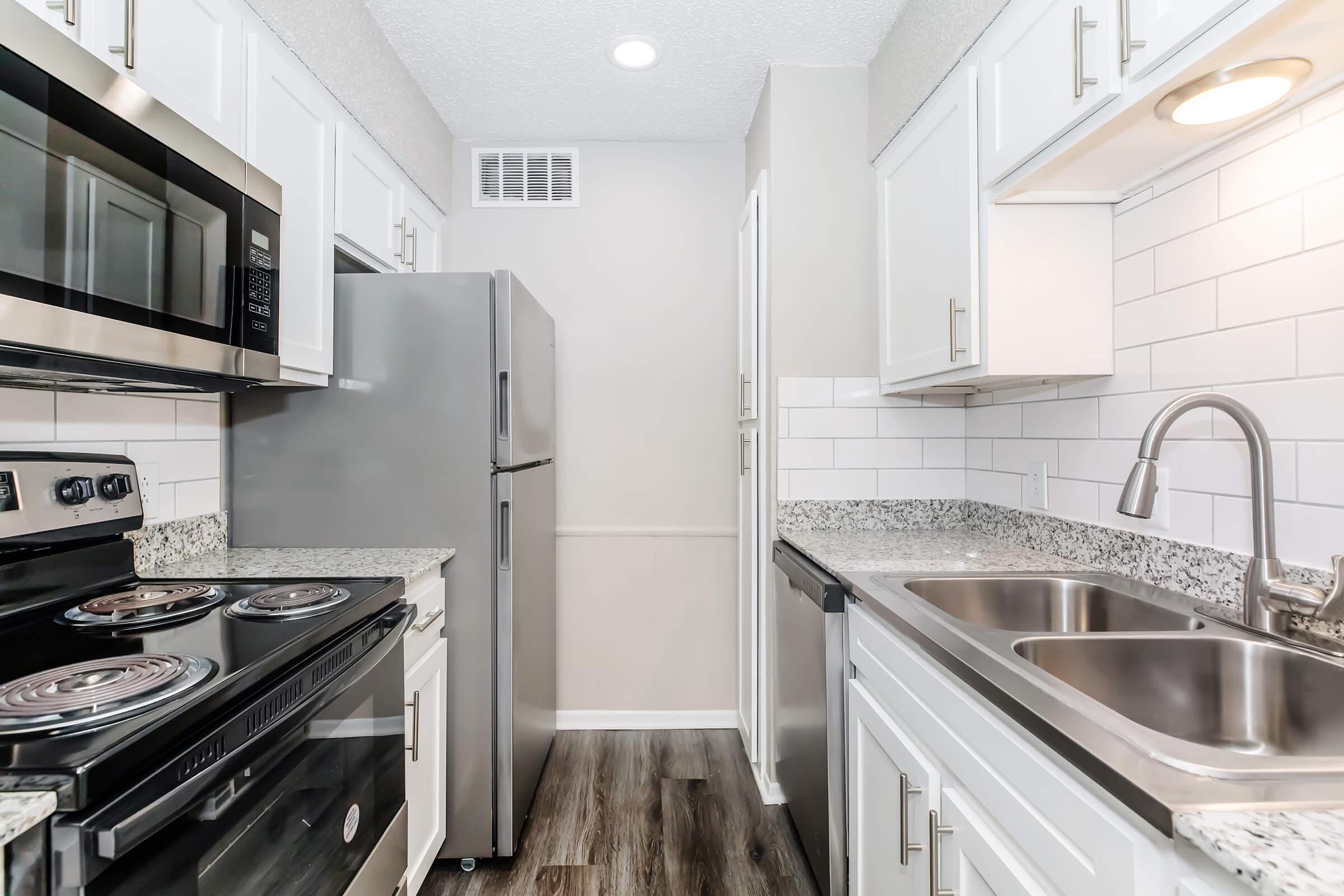 a kitchen with a stove and a sink