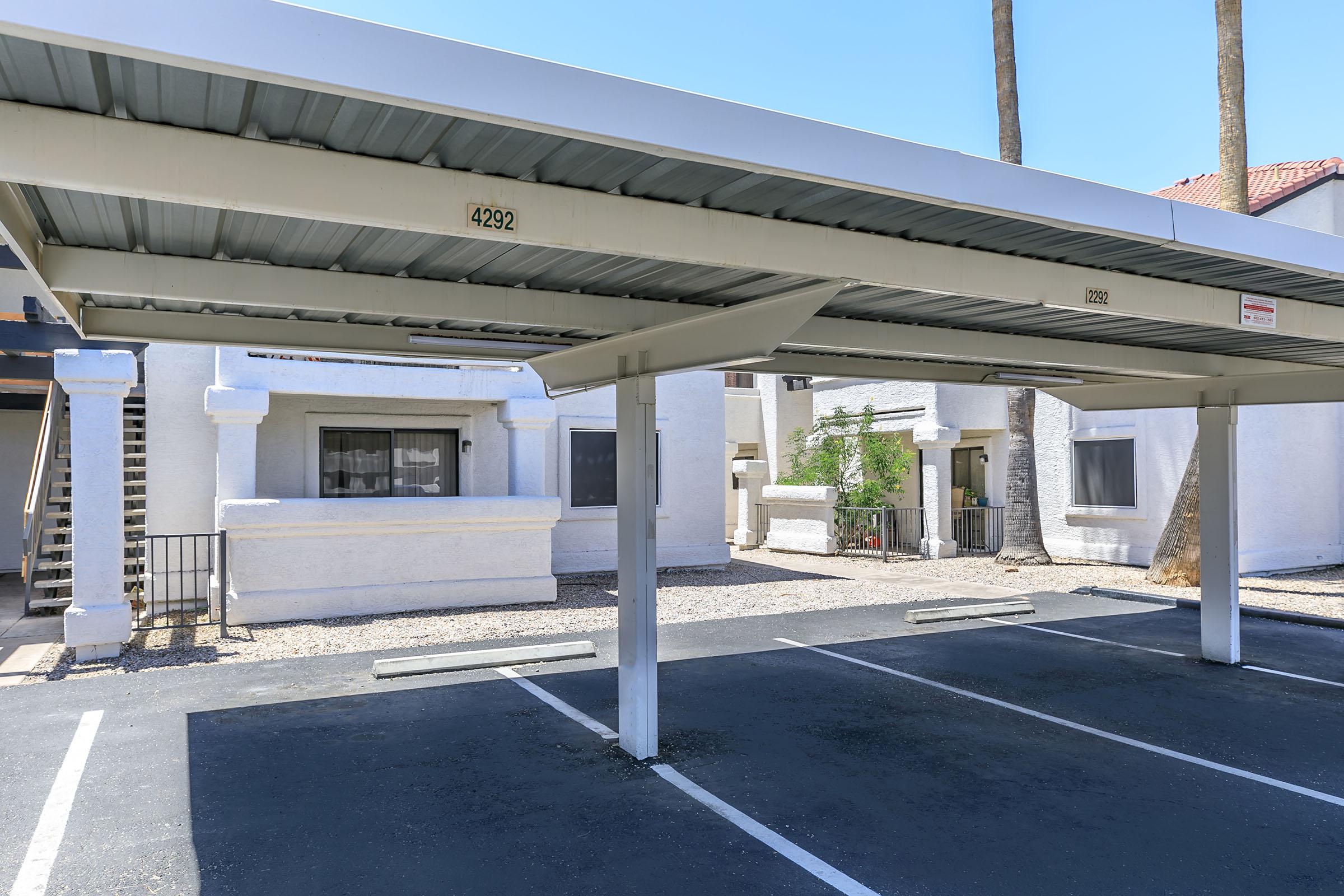 an empty parking lot in front of a building