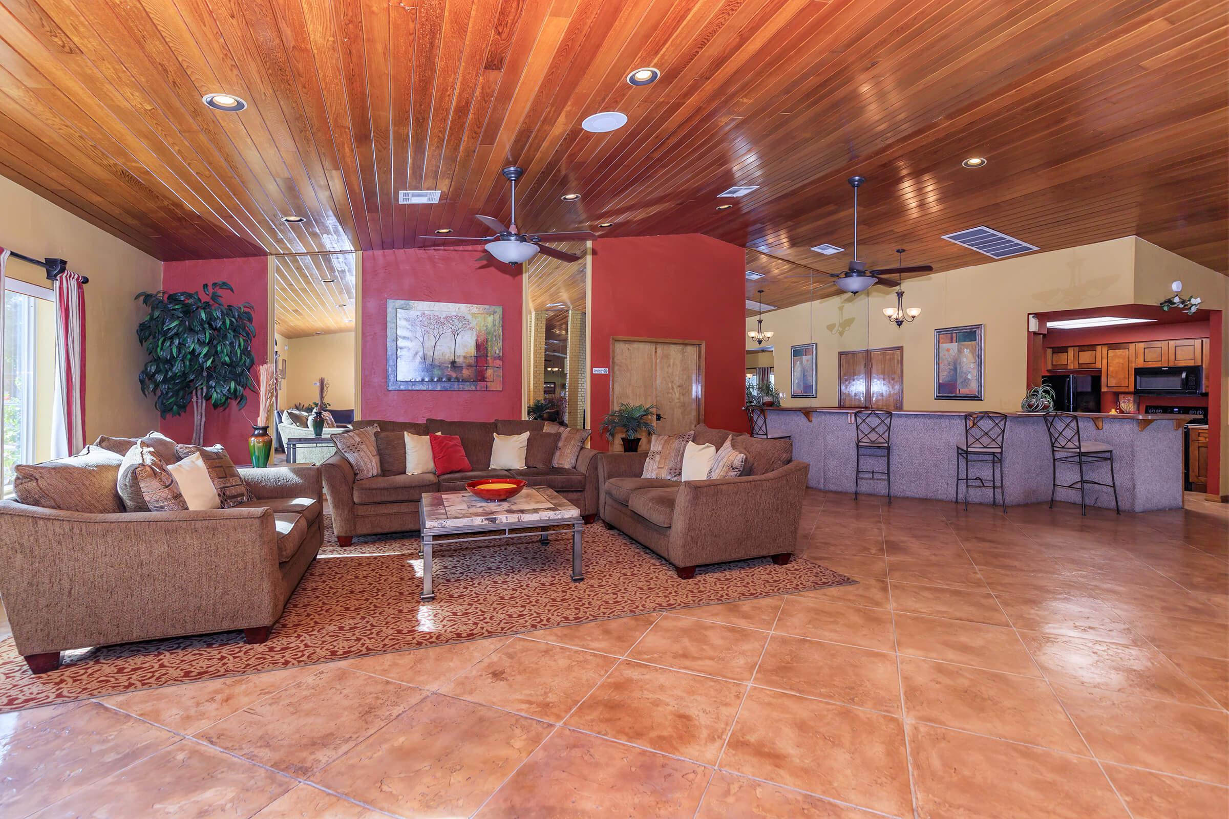 a living room filled with furniture and a fireplace