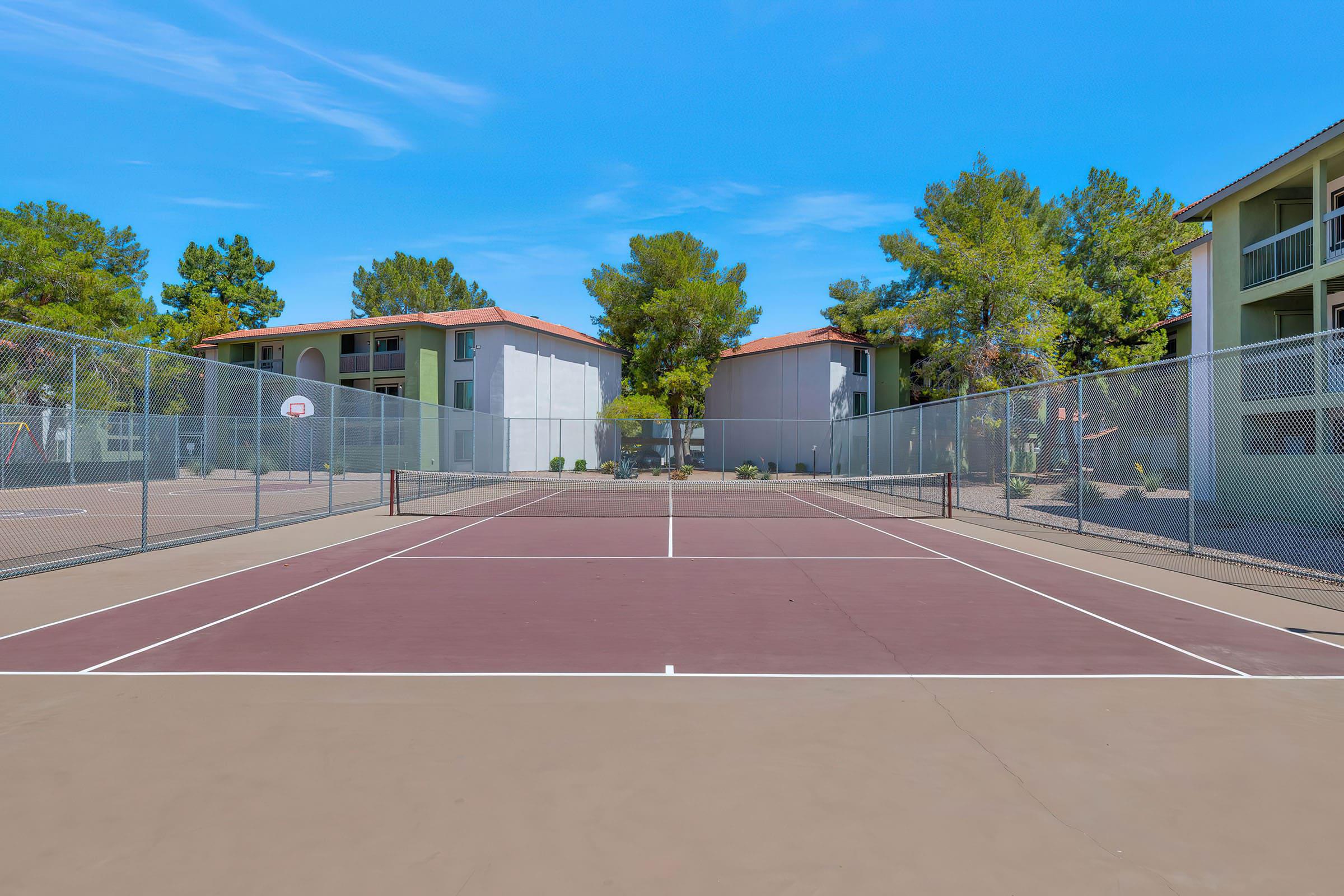 a basketball on a court with a racket