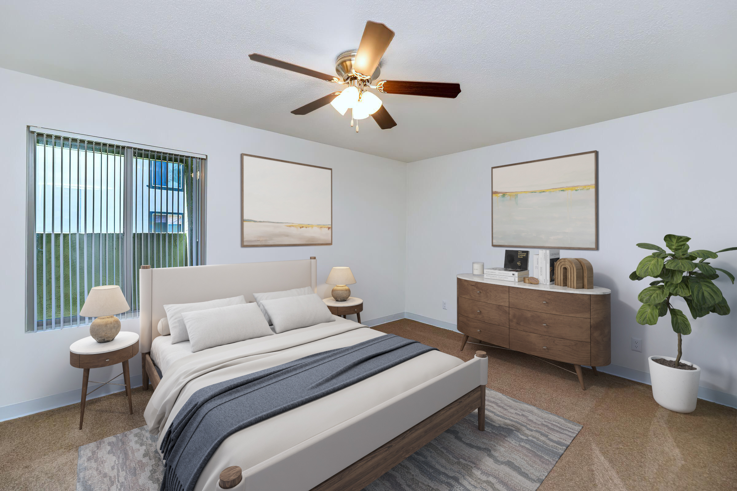 A modern bedroom featuring a light-colored bed with white bedding, two bedside tables with lamps, a dresser, and abstract wall art. A ceiling fan hangs above, and there is a potted plant in a corner. Natural light comes through a window with vertical blinds, adding a bright and airy feel to the space.