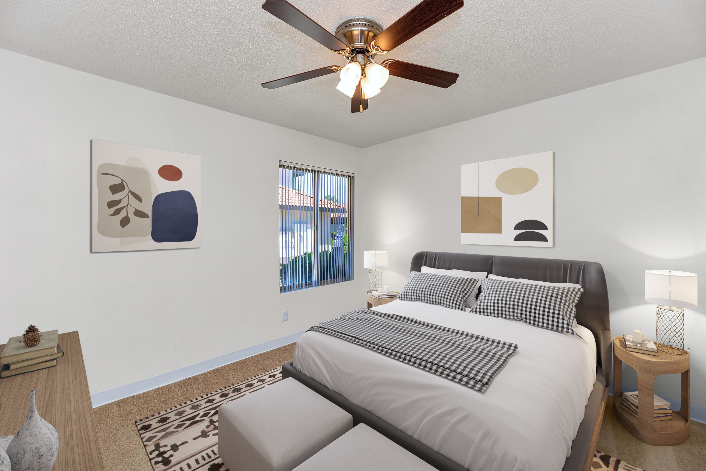 A modern bedroom featuring a large bed with decorative pillows, a stylish area rug, and two abstract art pieces on the walls. There are bedside lamps on both sides of the bed, and a window with vertical blinds allowing natural light to filter in. A ceiling fan is visible overhead, enhancing the room's comfort.