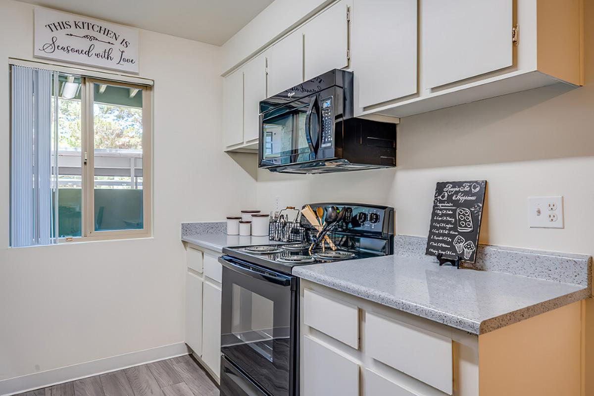 a kitchen with a sink and a window