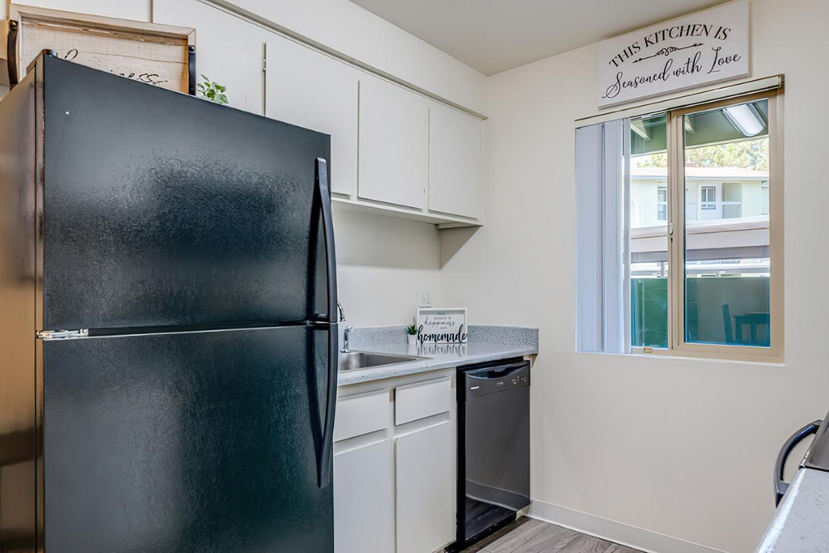 a stainless steel refrigerator in a kitchen