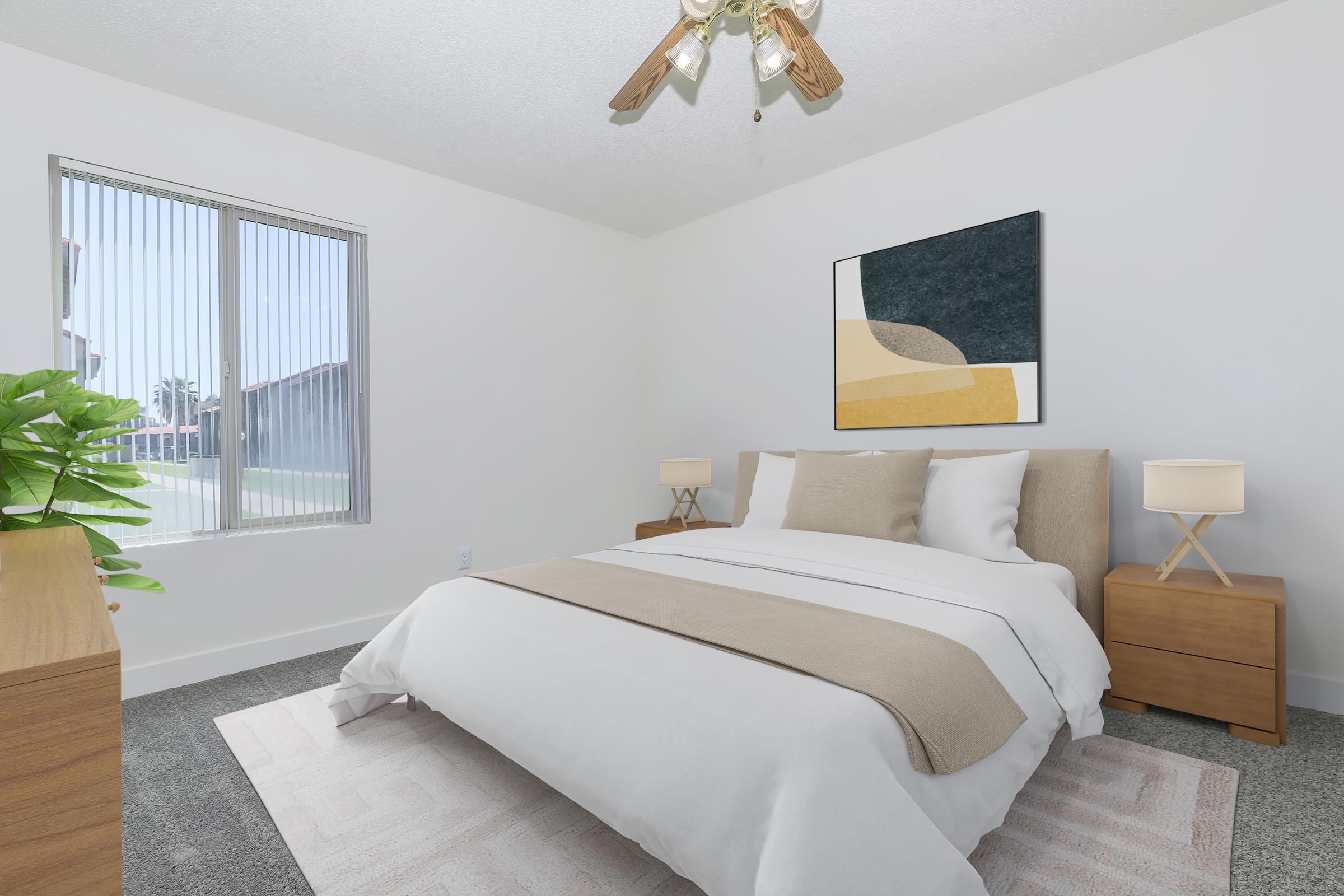 Bright and modern bedroom featuring a queen-sized bed with a beige and white duvet, two wooden nightstands with lamps, and a large window allowing natural light. A decorative painting hangs above the bed, and a green potted plant adds a touch of greenery to the space. A plush area rug complements the decor.