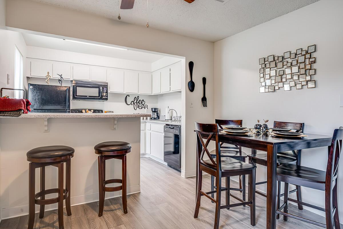 a kitchen with a dining room table