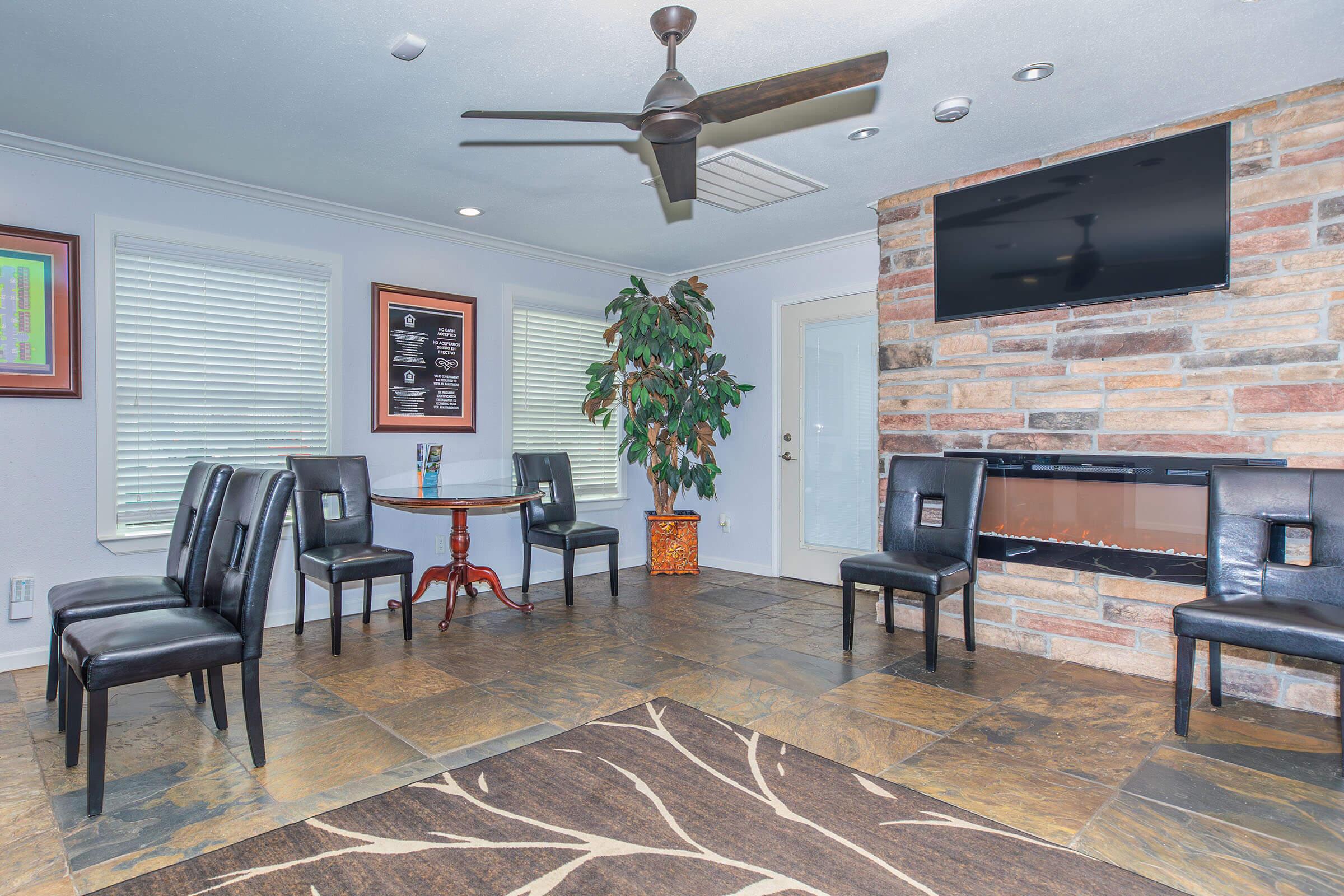 a living room filled with furniture and a fireplace