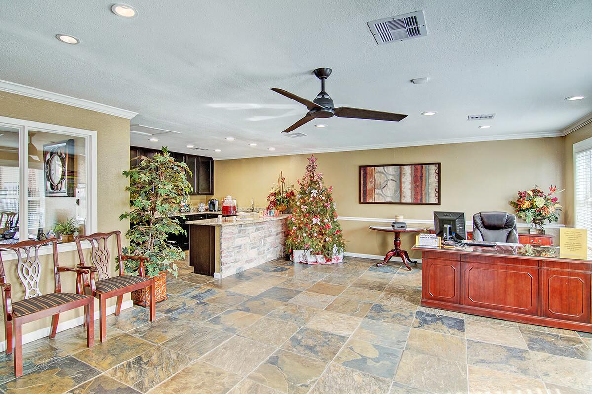 a living room filled with furniture and a fireplace