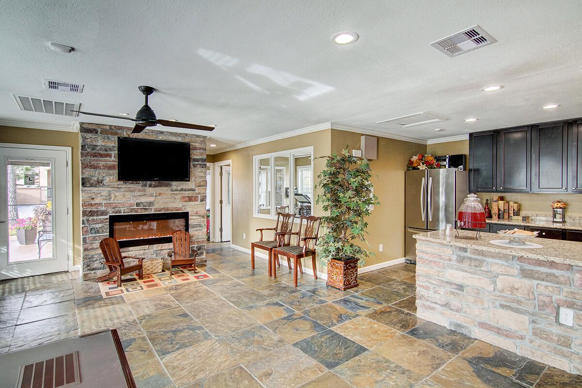 a living room filled with furniture and a fire place