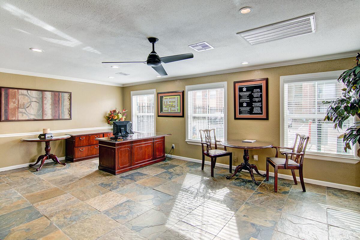 a living room filled with furniture and a fireplace