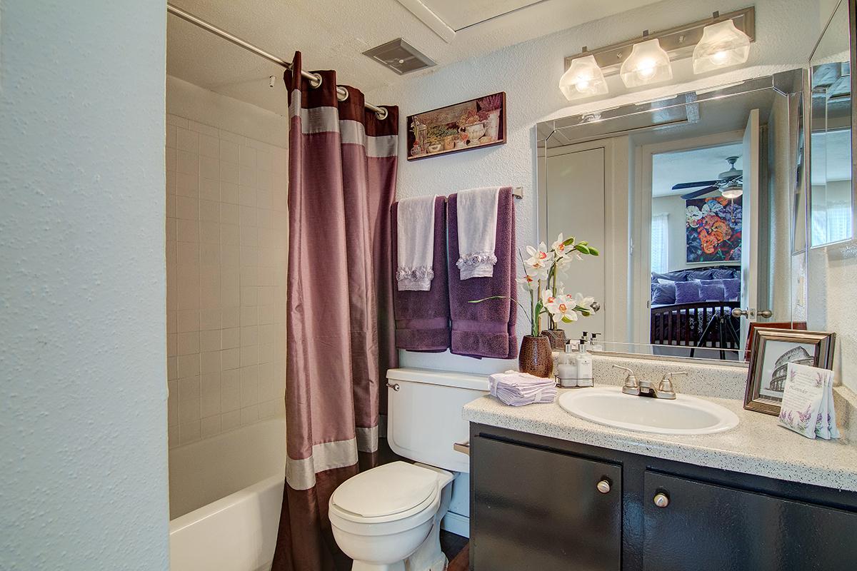 a large white tub sitting next to a sink