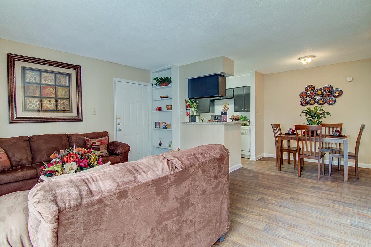 a living room filled with furniture and a fireplace