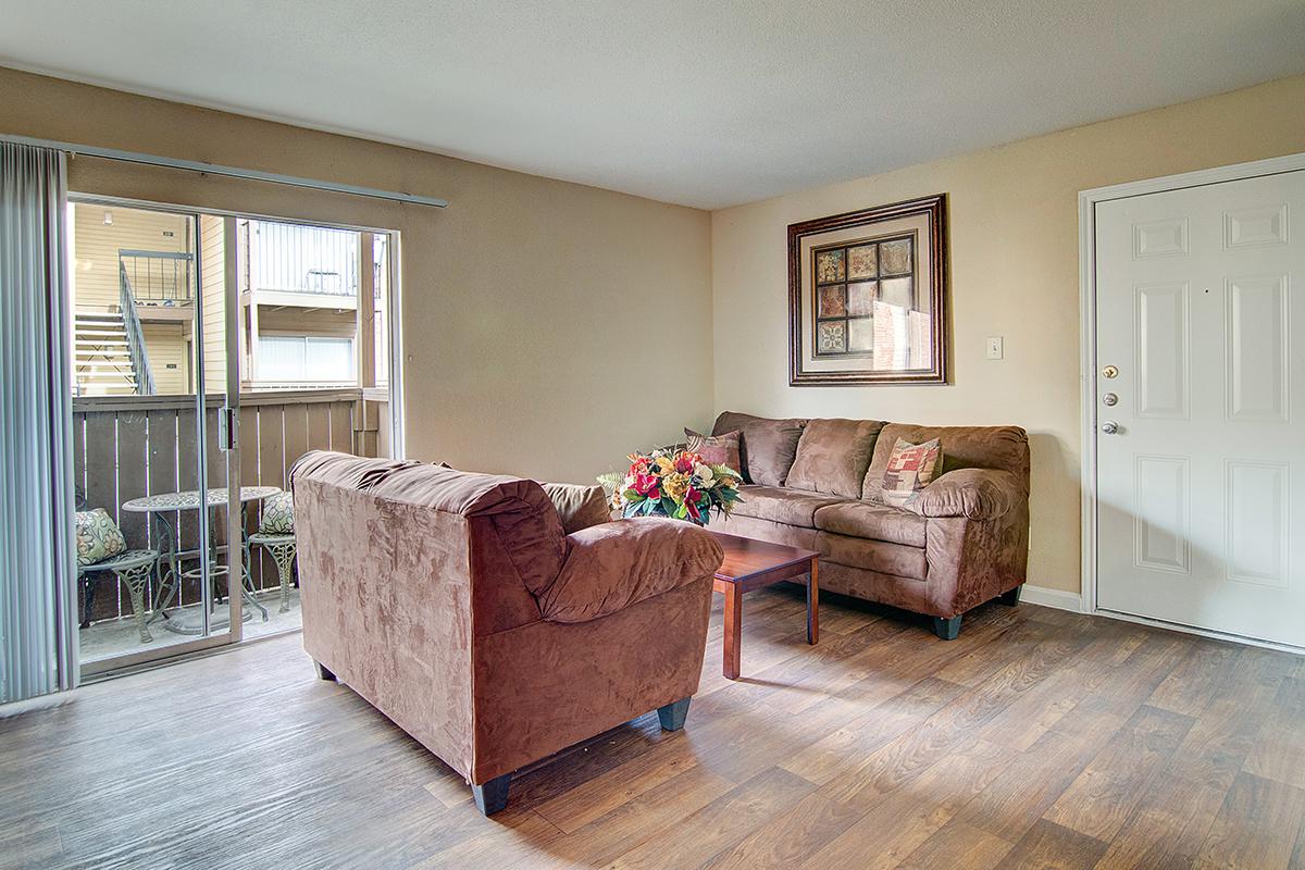 a living room filled with furniture and a fireplace