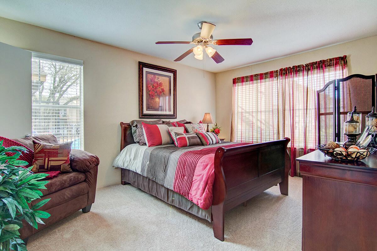 a living room filled with furniture and a flat screen tv