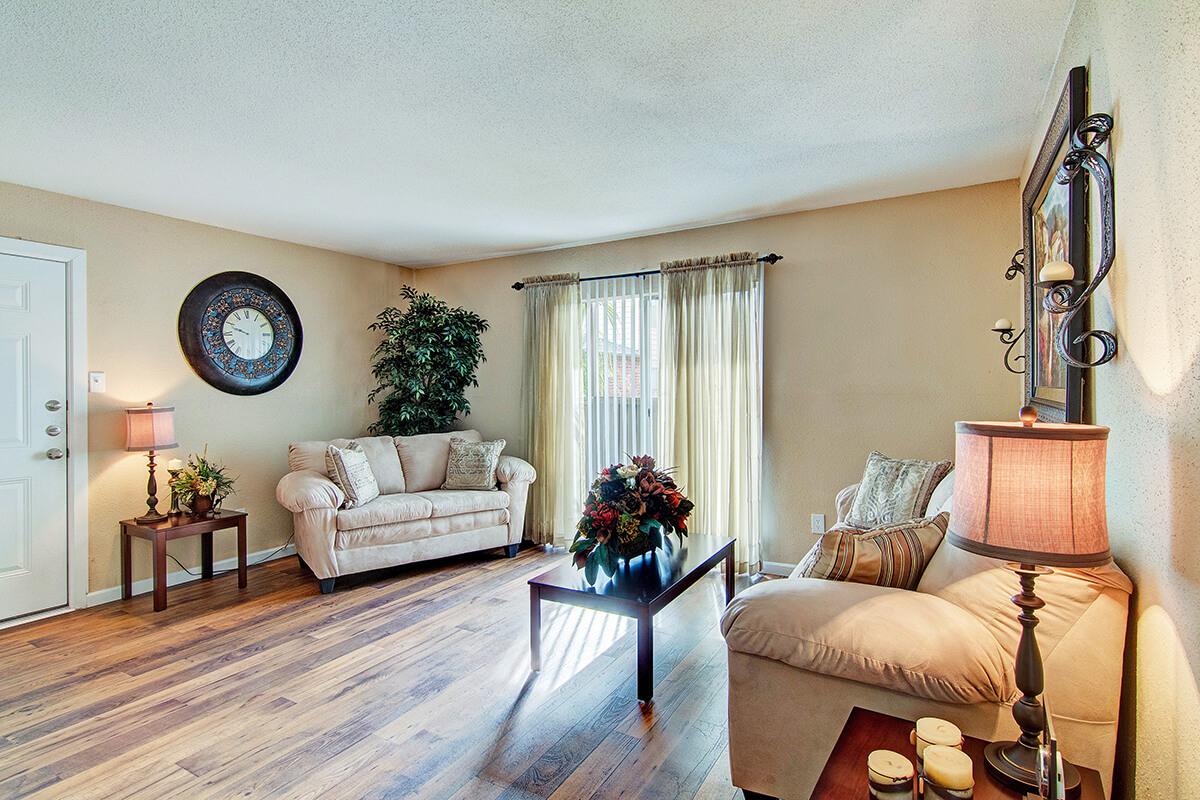 a living room filled with furniture and a fire place