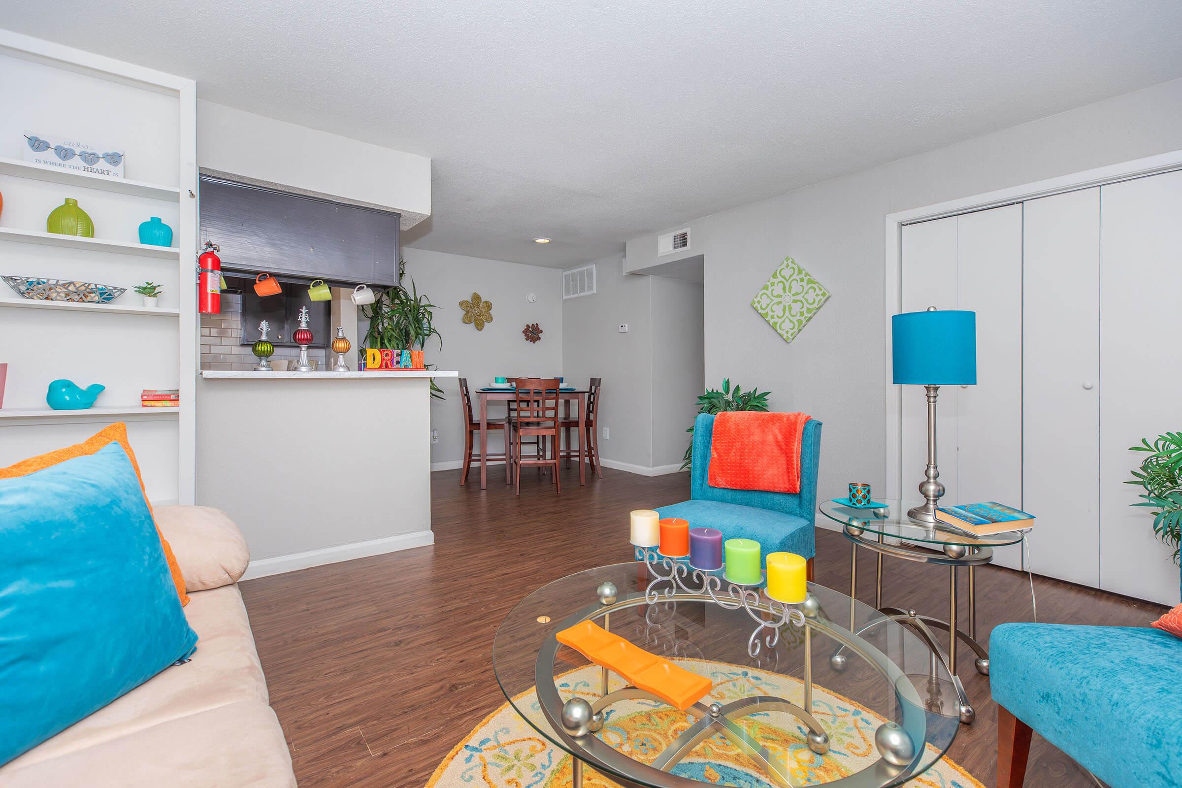 a living room filled with furniture and a flat screen tv