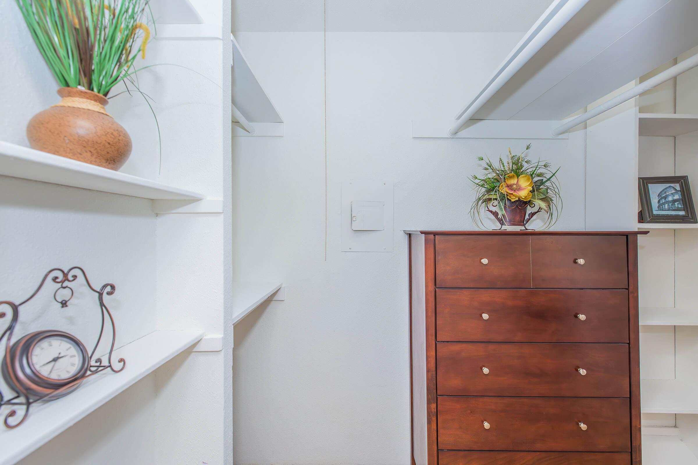 a vase of flowers sitting on top of a wooden door