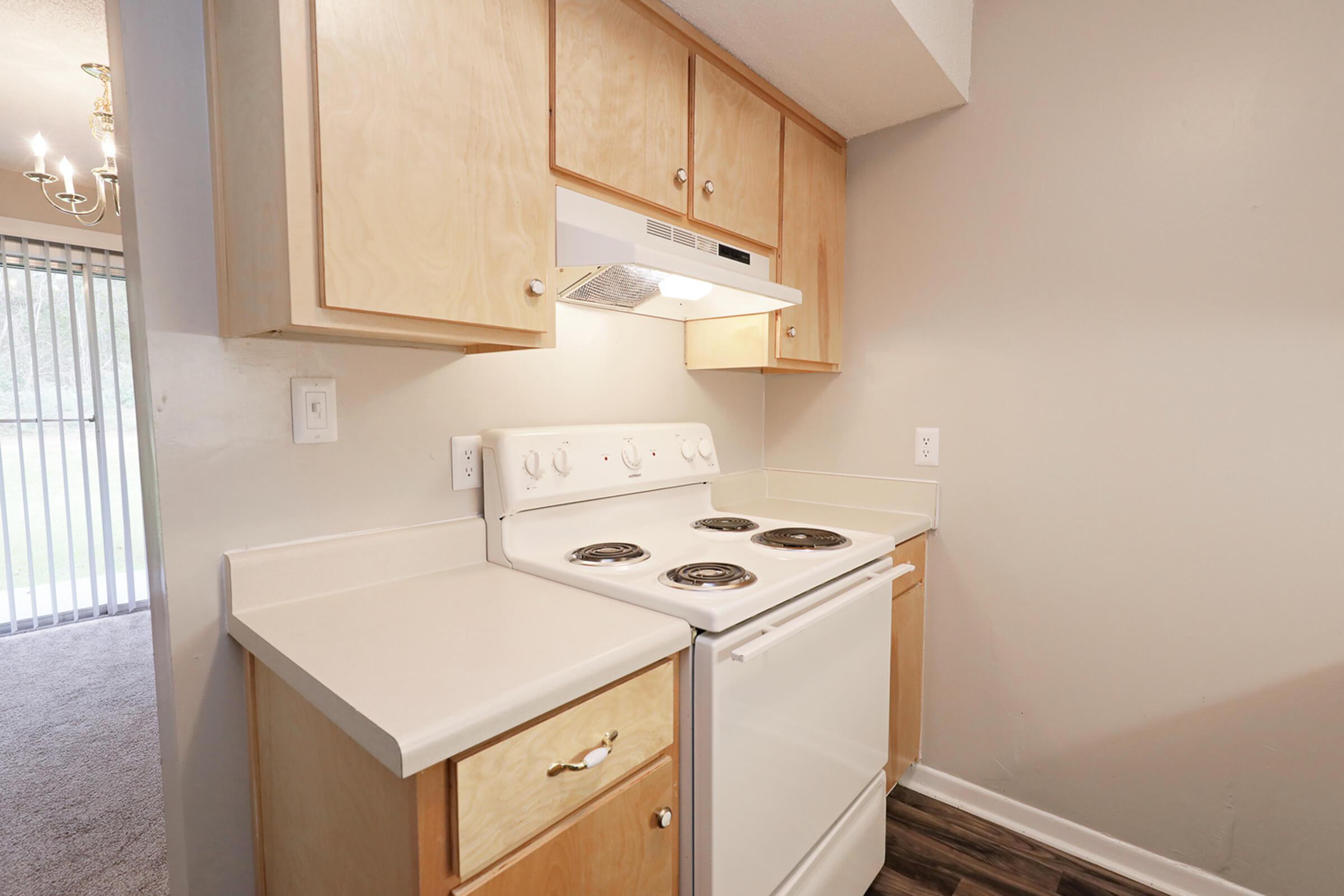 a small white sink in a kitchen