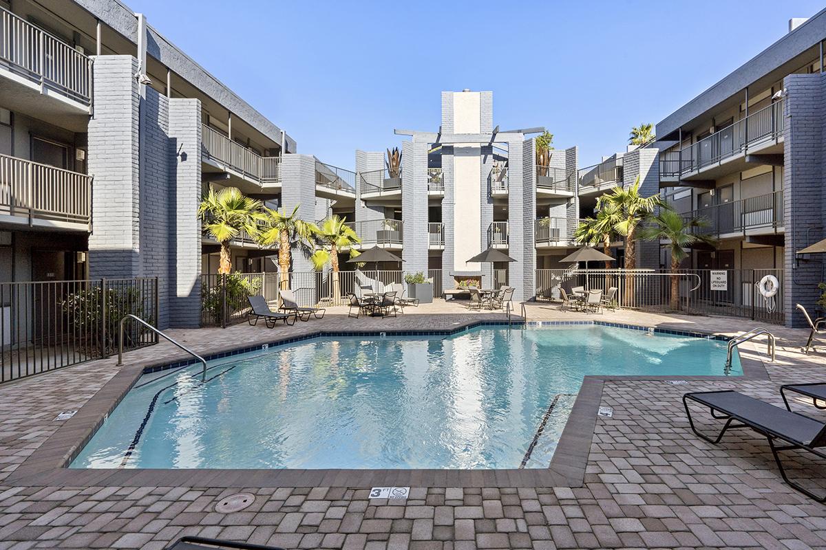 a large brick building with a pool