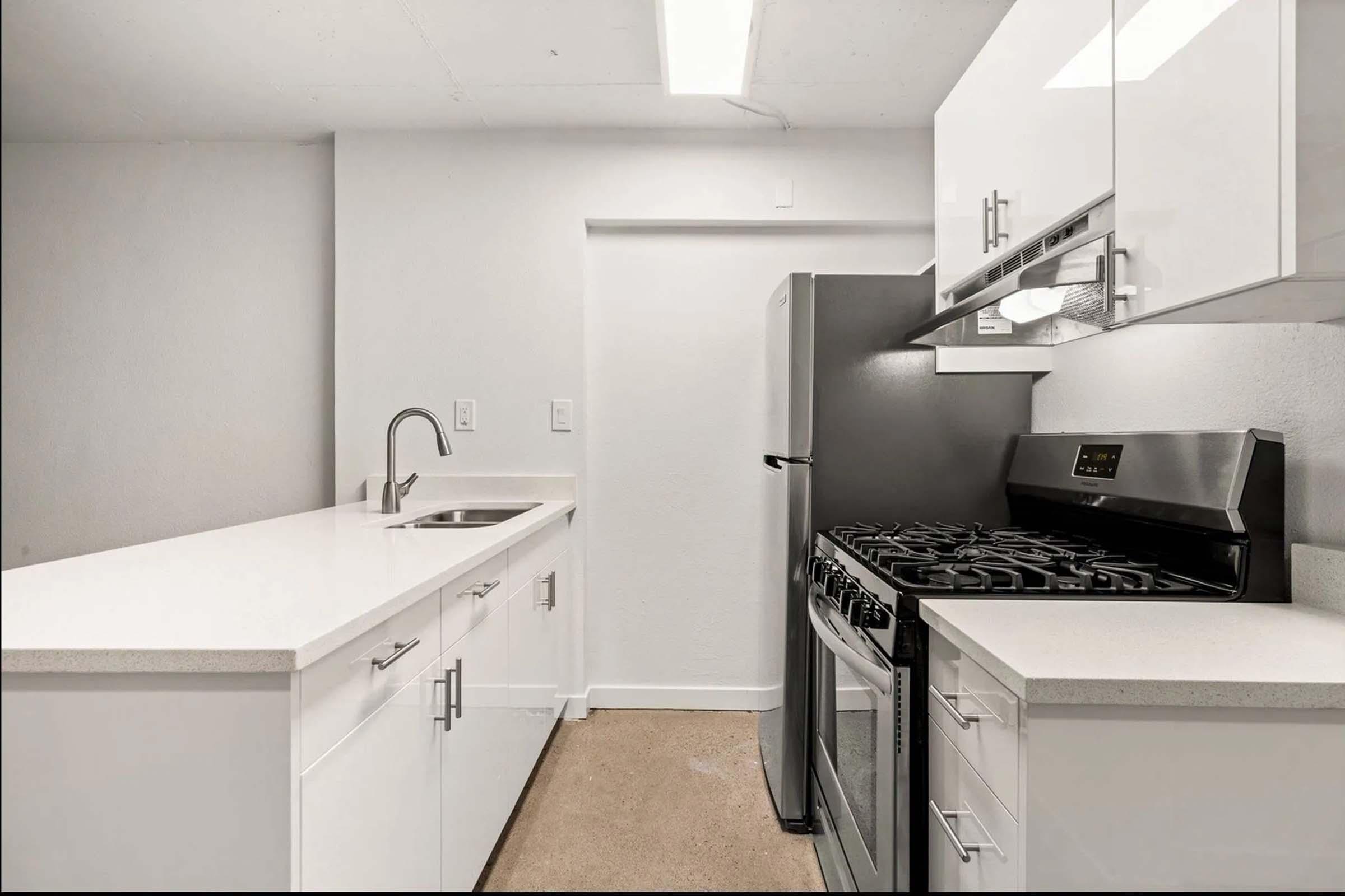 a kitchen with a sink and a microwave