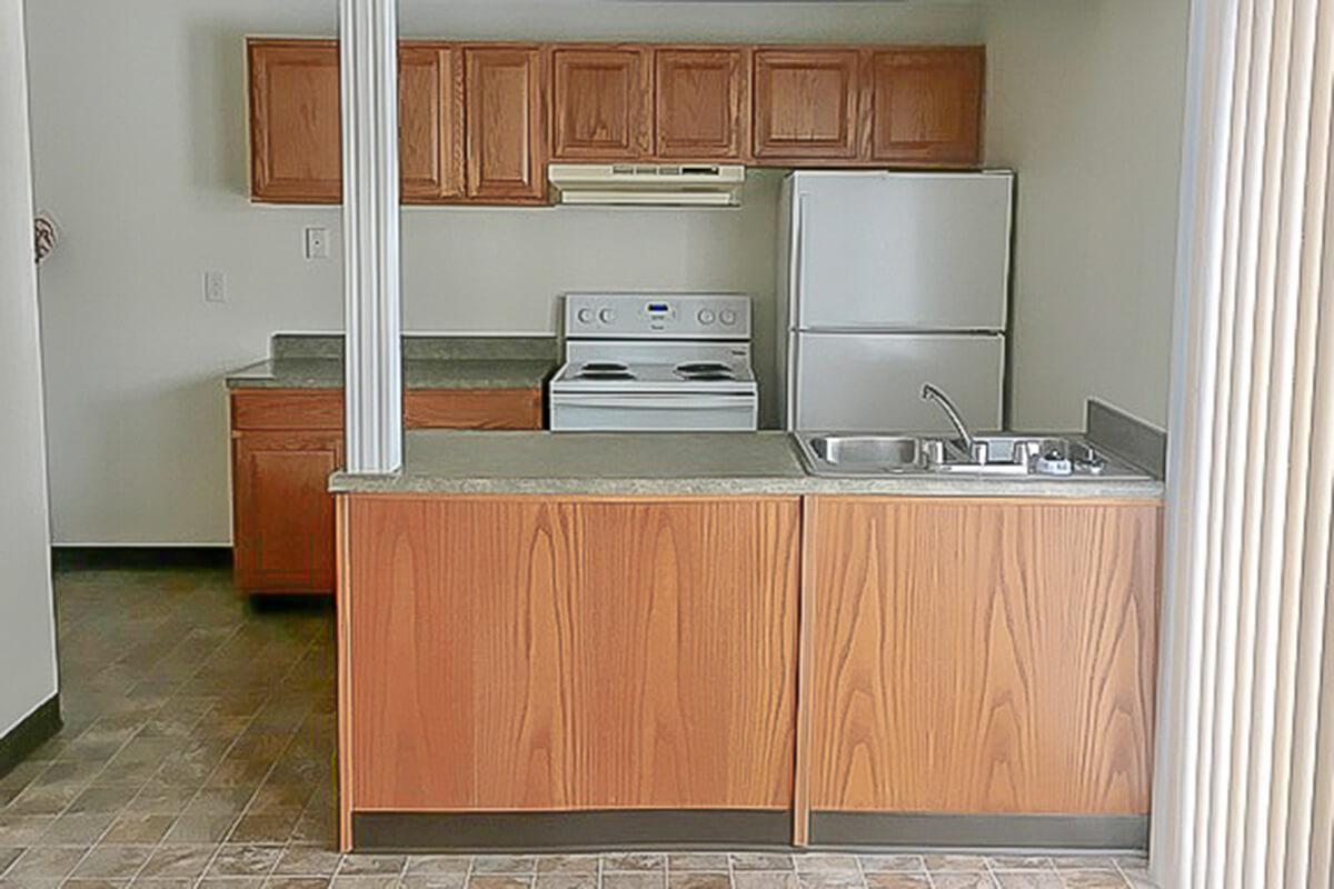 a white refrigerator freezer sitting inside of a kitchen