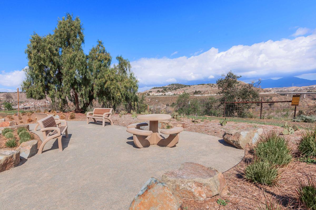 Sendero Bluffs Senior Apartments mountain view with benches