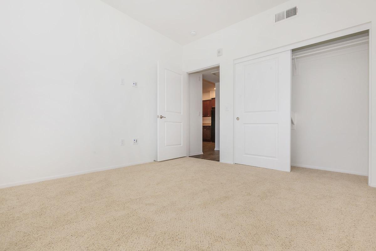 Bedroom with open sliding closet door