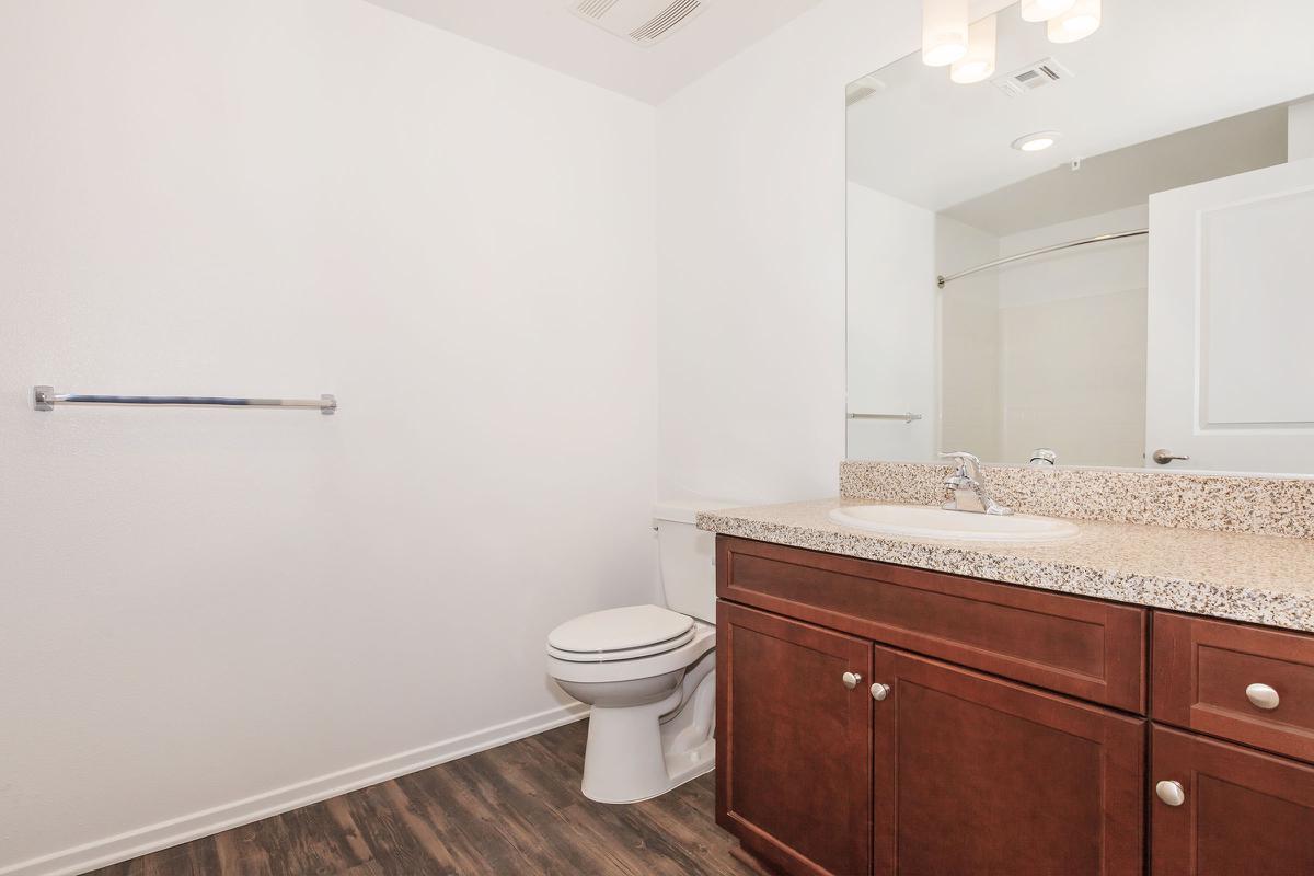 Unfurnished bathroom with wooden cabinets