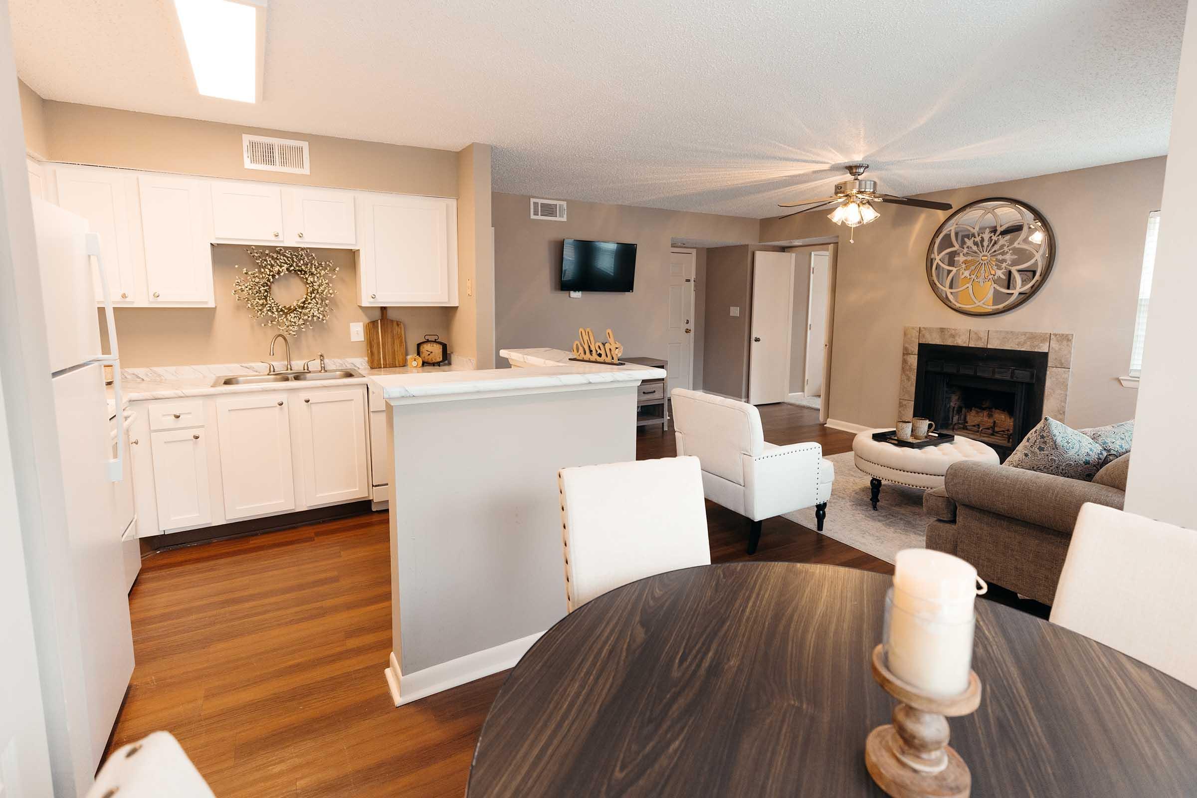 a living room filled with furniture and a fireplace