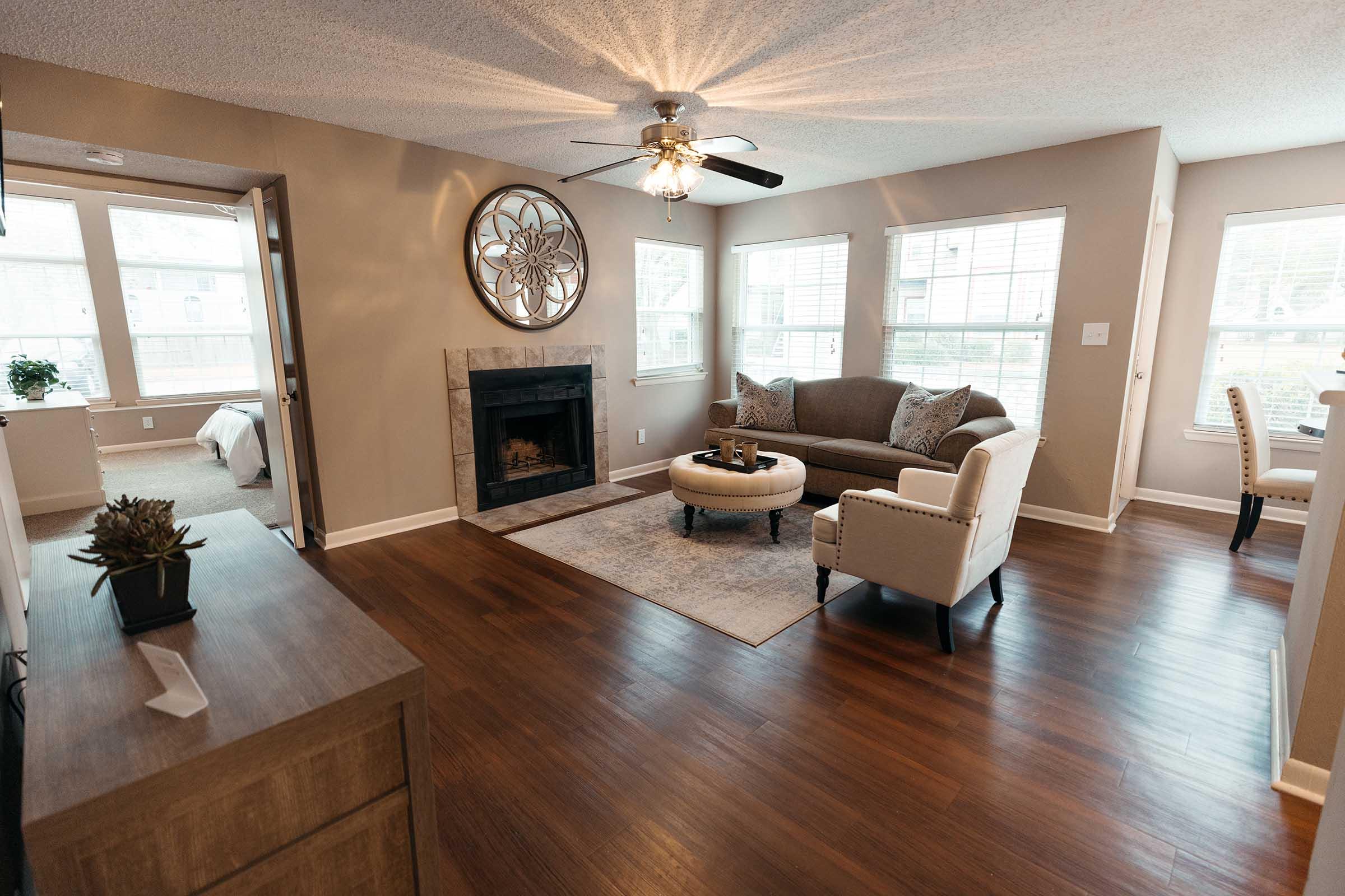 a living room filled with furniture and a large window