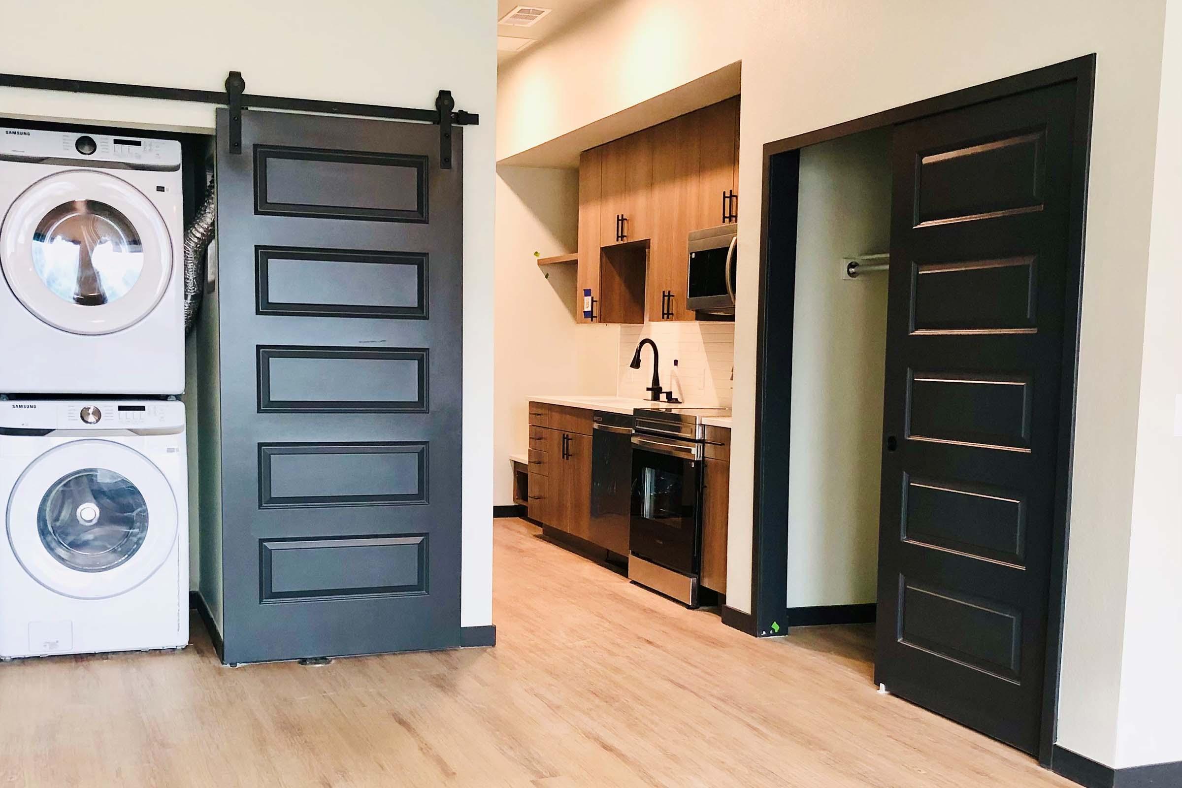 a kitchen with a stove top oven sitting inside of a building