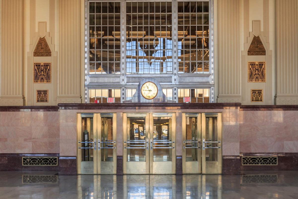 a clock that is on display in front of a building