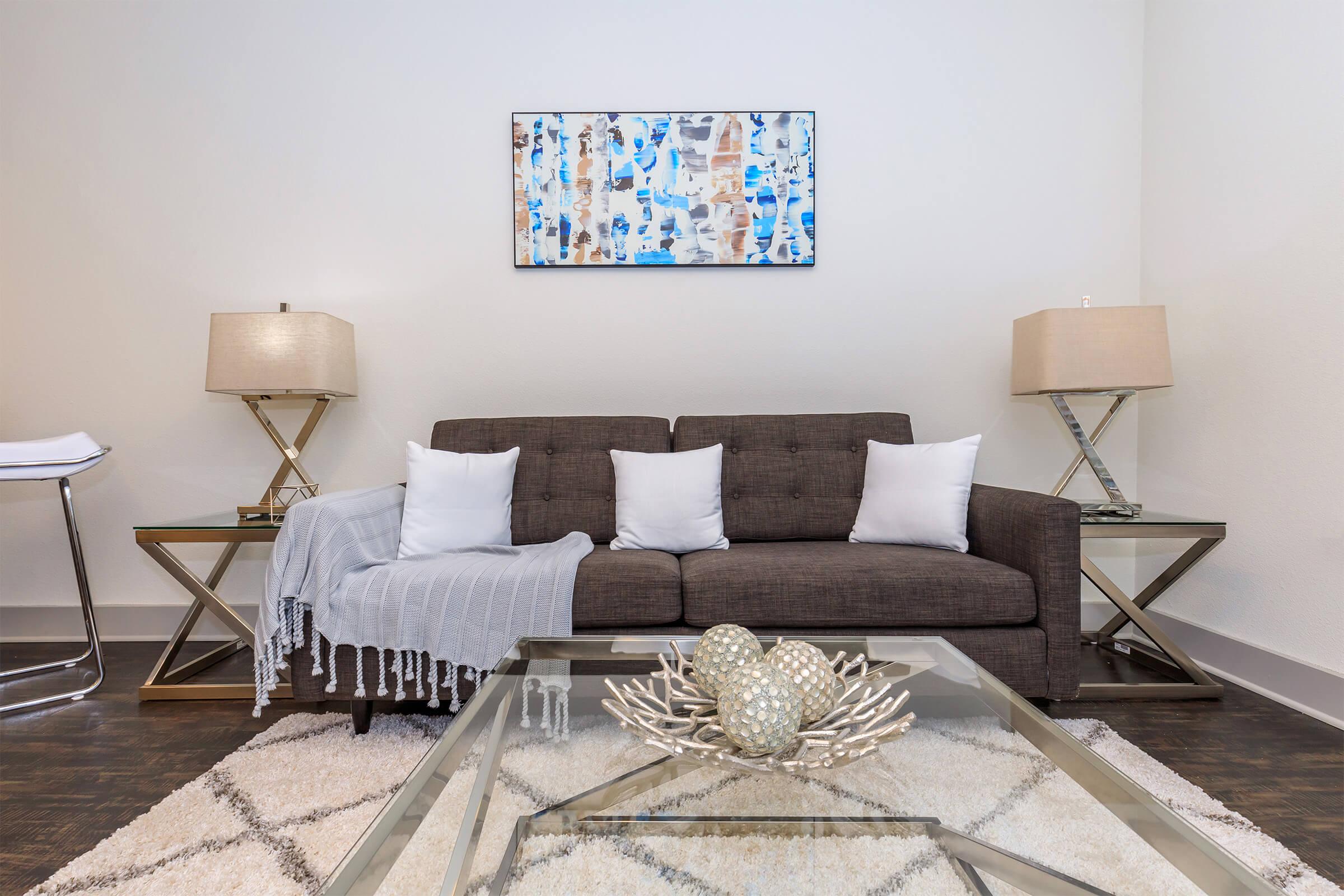 a living room filled with furniture and a rug