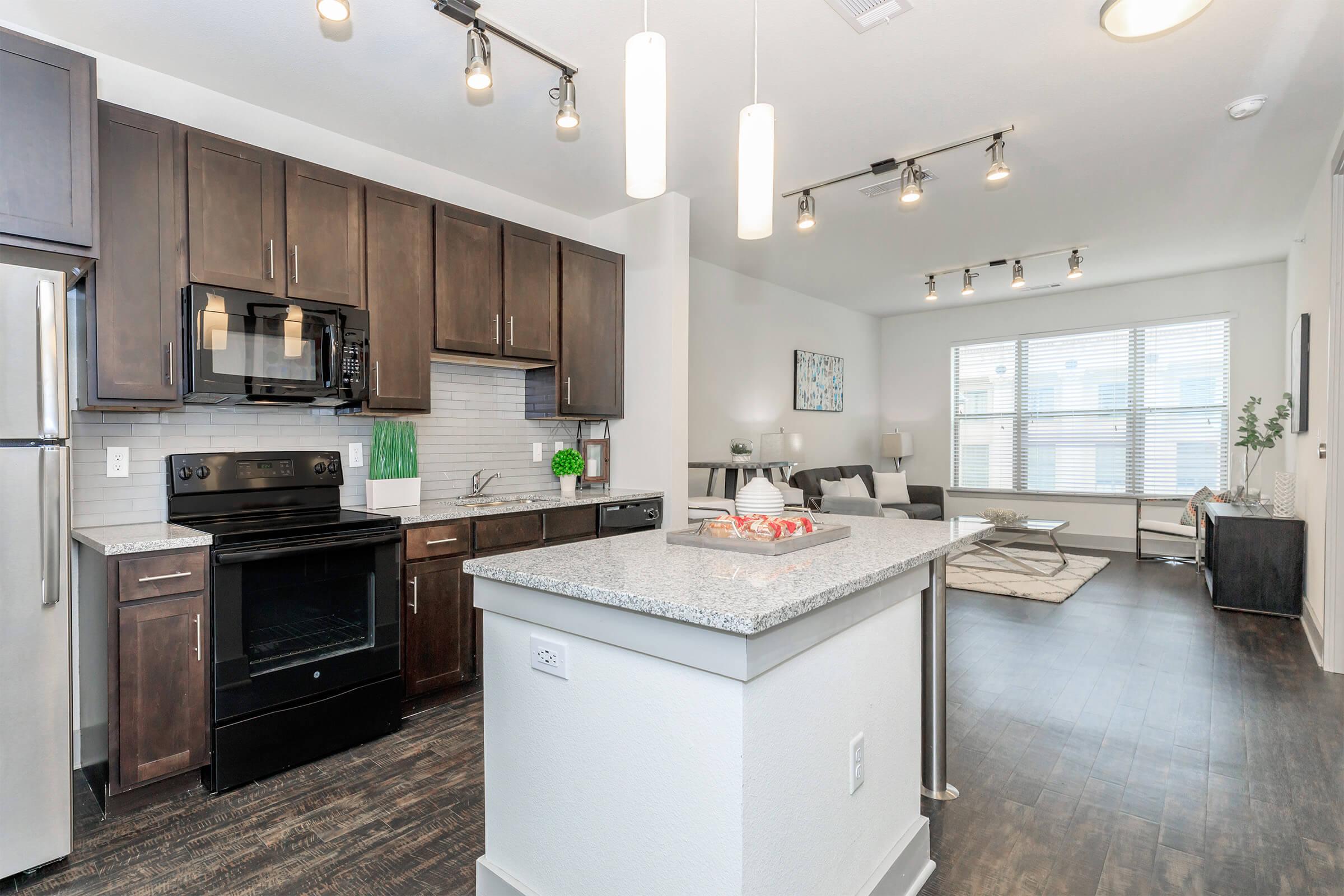 a modern kitchen with stainless steel appliances