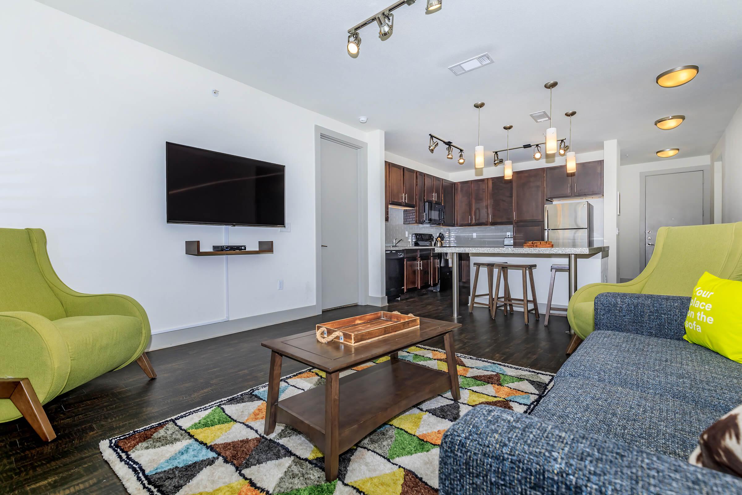 a bedroom with a bed and a couch in a living room