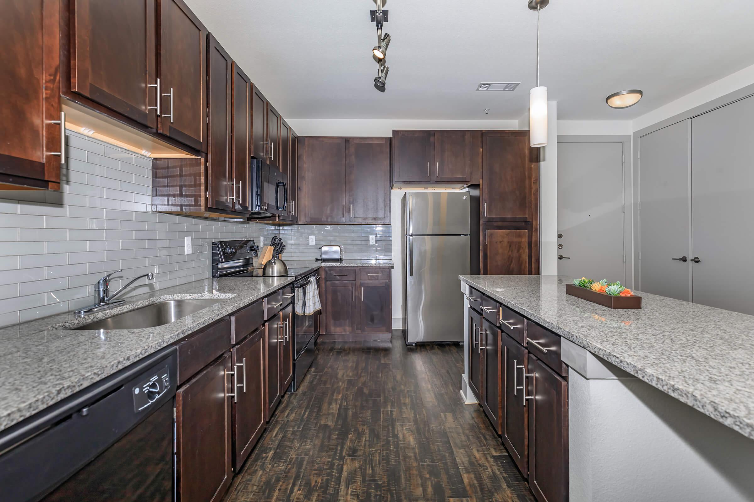 a large kitchen with stainless steel appliances