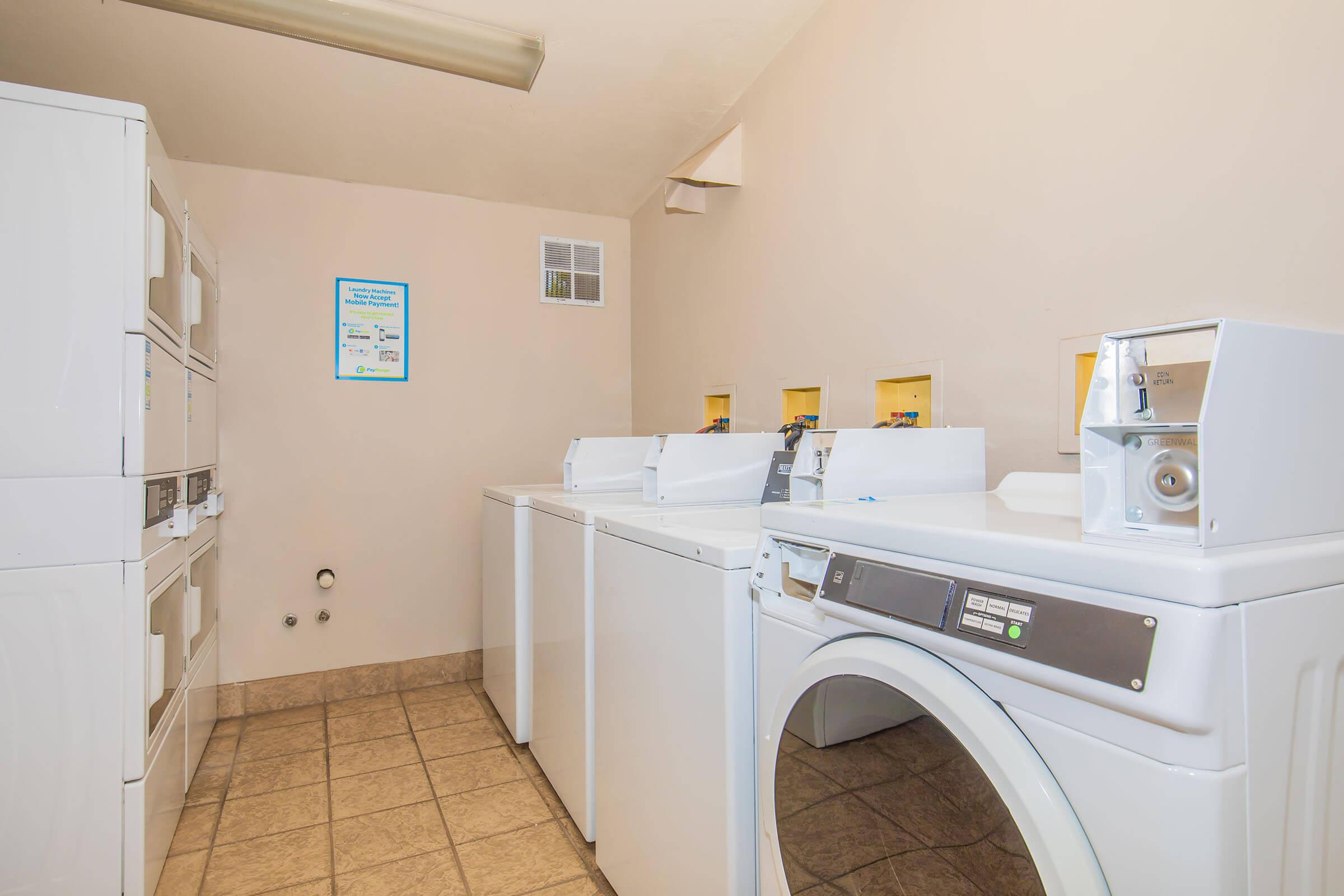 a kitchen with a sink and a refrigerator