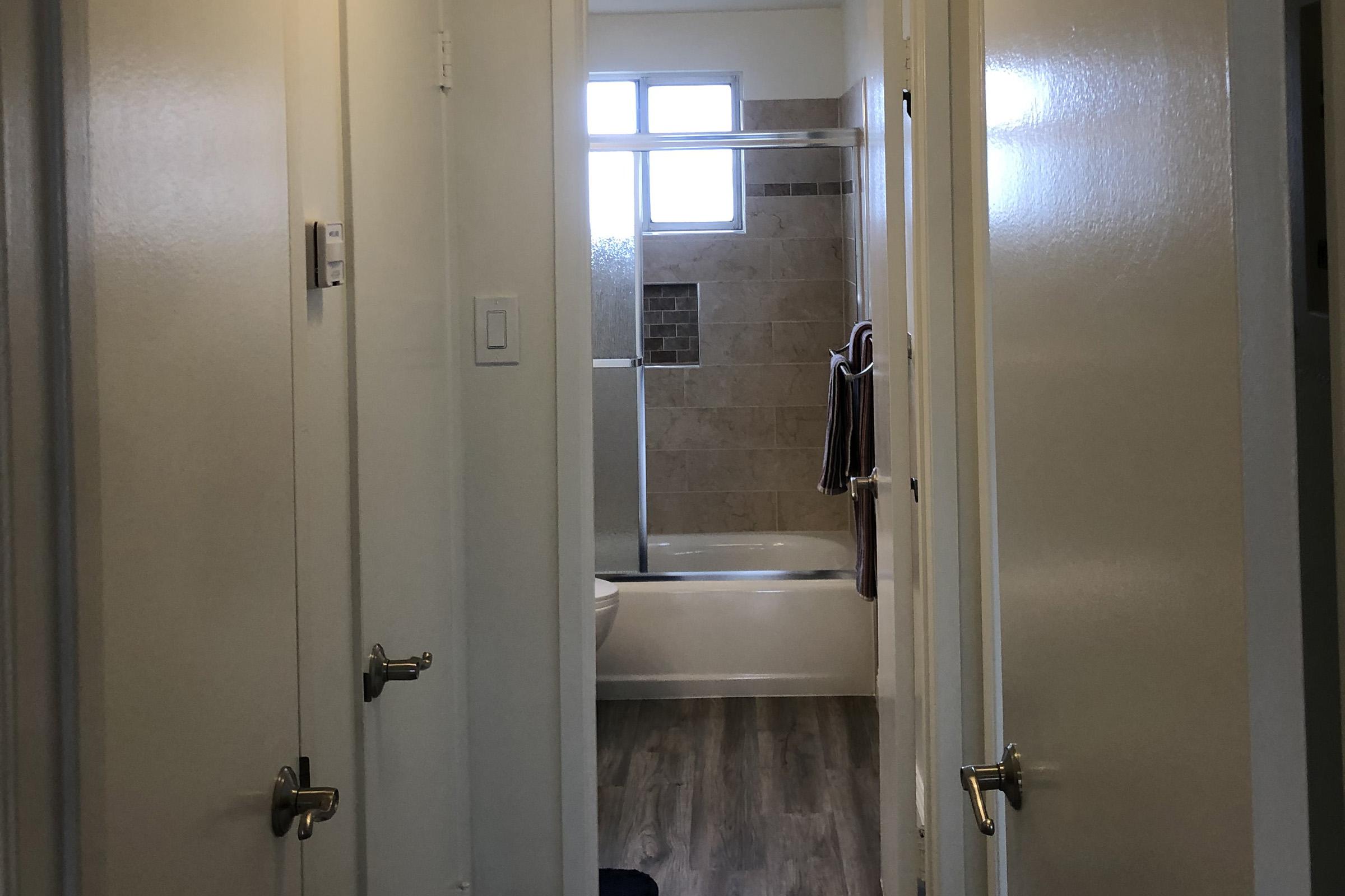 a view of the shower and sink