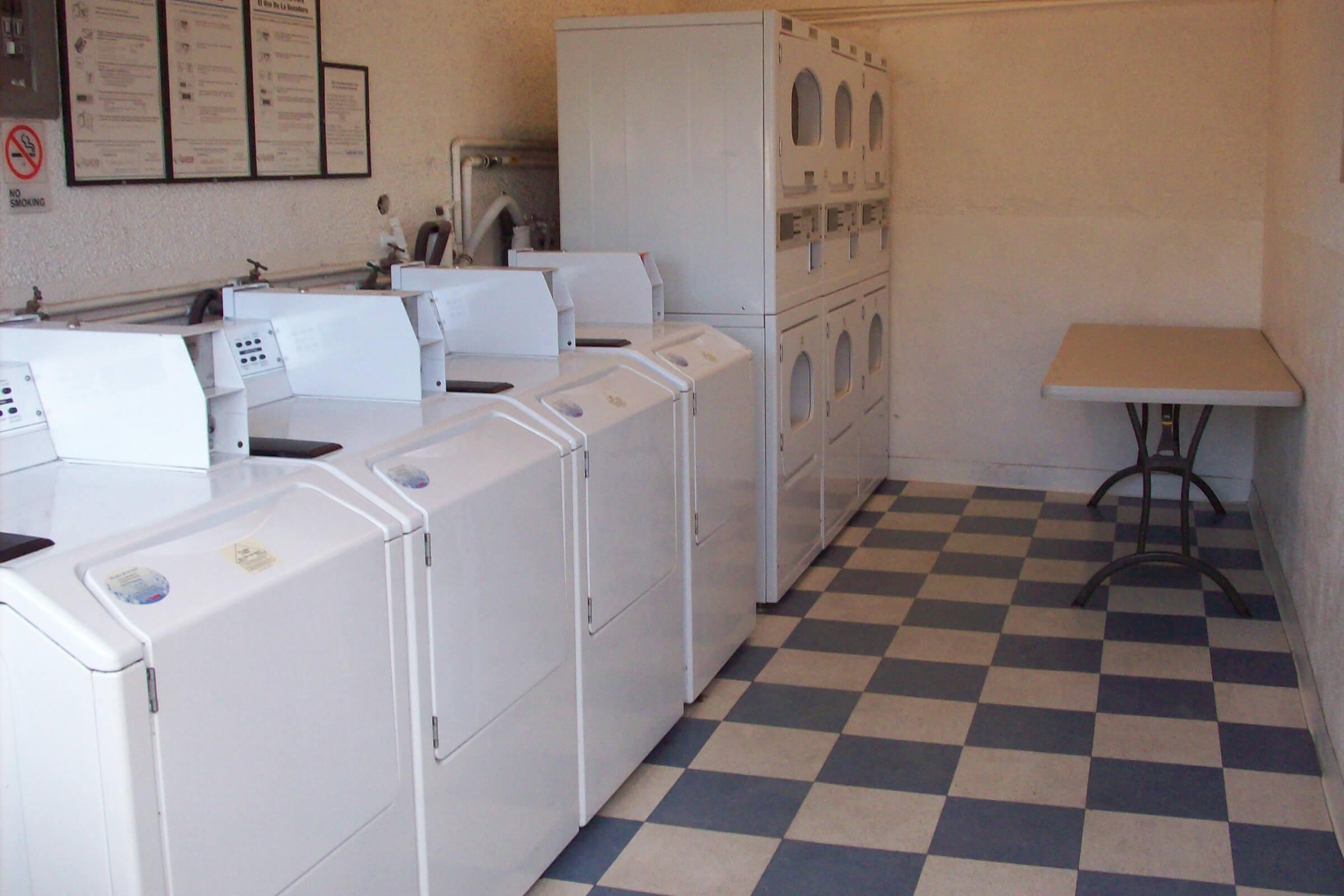 Washer and dryers in Kona Kai Apartments community laundry