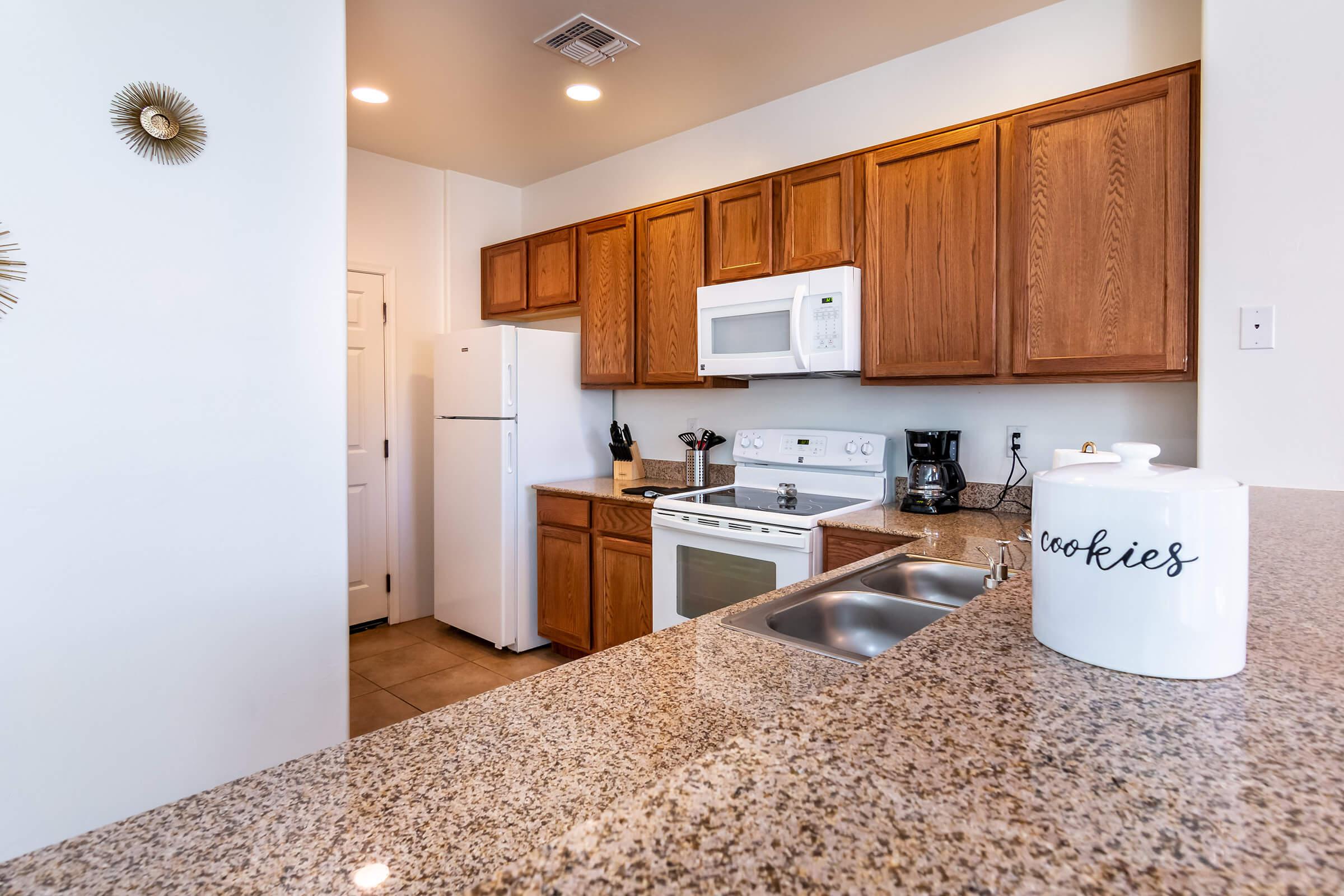 a kitchen with a sink and a refrigerator