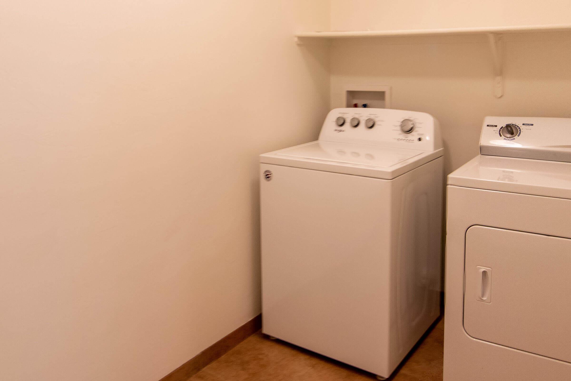 a microwave oven sitting on top of a refrigerator