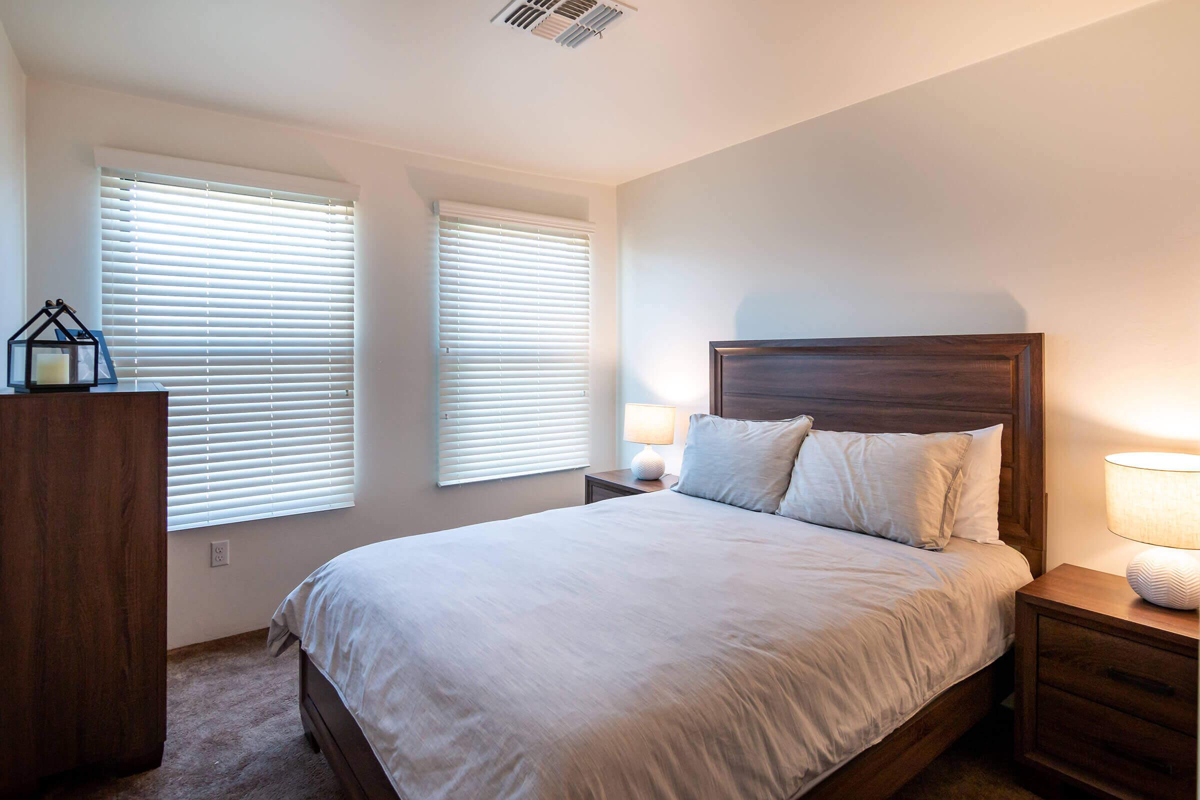 a bedroom with a large bed in a hotel room