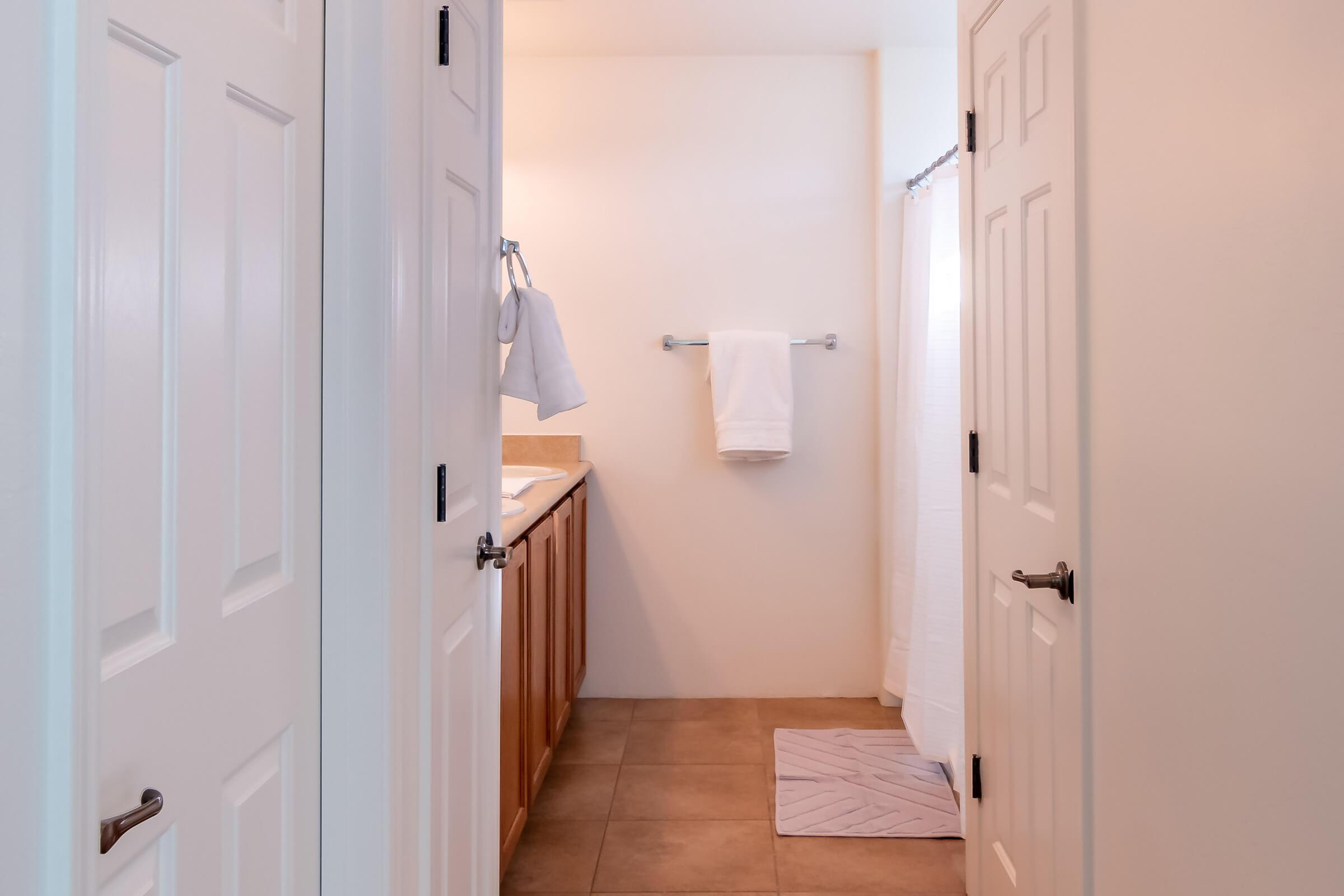 a kitchen with a sink and a refrigerator