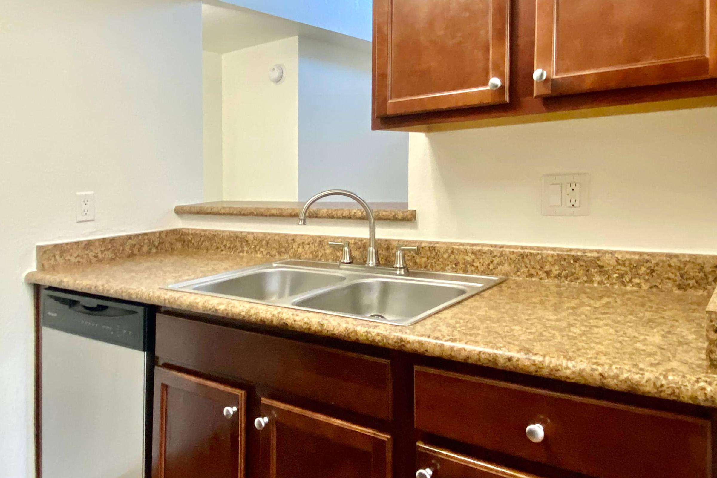 a kitchen with a sink and a microwave