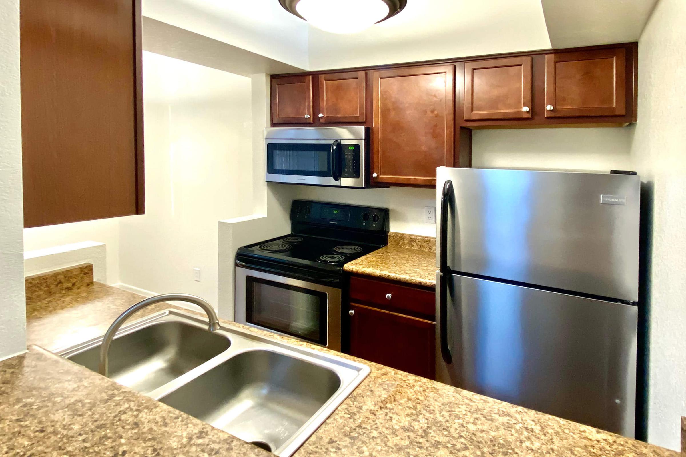 a modern kitchen with stainless steel appliances