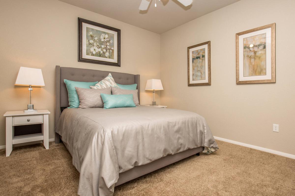 COMFORTABLE BEDROOM AT THE FAIRWAYS AT SOUTHERN HIGHLANDS APARTMENTS