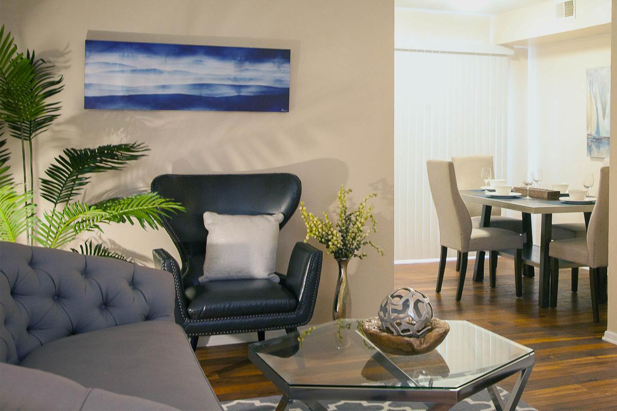 a living room filled with furniture and a table